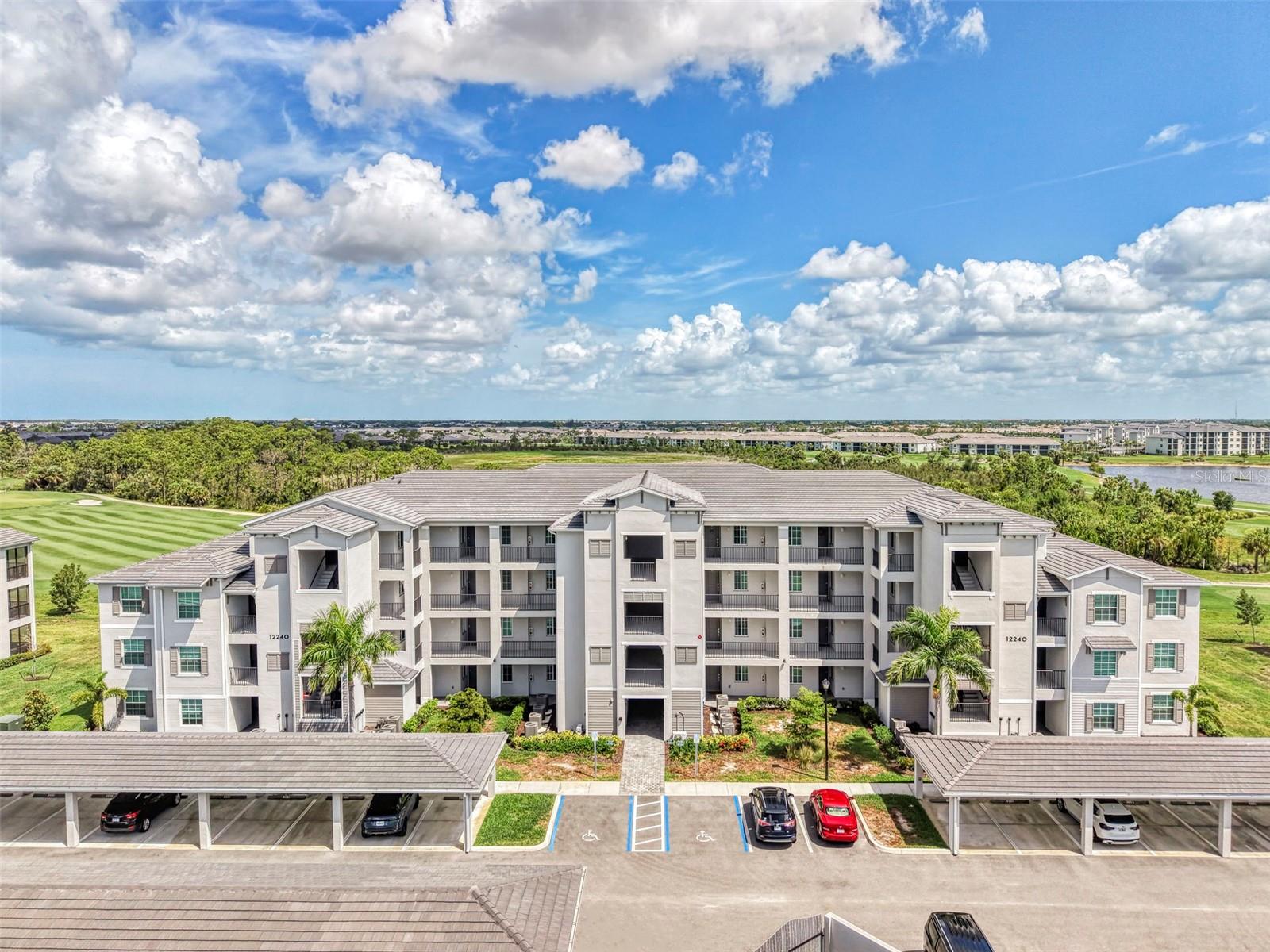 Now is your opportunity to own this THIRD-FLOOR condo in the new and exciting community of Wellen Park Golf and Country Club. This Arbor model floor plan is being sold TURN-KEY FURNISHED and features a stunning view that includes sweeping vistas of the golf course and a protected bird sanctuary. The builder is SOLD OUT of golf included terrace condos. The GOLF MEMBERSHIPS are deeded with this unit, and the resort style amenities are 5 stars! The unit is easily accessed by an elevator and includes an extra private storage room located just outside the unit, providing additional storage. Once inside, you will be impressed by the beautiful upgrades such as tile on the diagonal throughout all the main living spaces, white shaker style cabinets, quartz countertops, and a stainless-steel appliance package. Additional features include custom installed backsplash, paint, tile accents in both bathrooms, and upgraded fans. The condo is flooded with light, and all windows are outfitted with custom fitted blinds. In-unit laundry includes a washer and dryer for ease and convenience. The completely private screened lanai enjoys sweeping views that are sure to impress and will bring you hours of peace and enjoyment while you relax after a long day on the course. This condo features 2 bedrooms, 2 bathrooms, two large walk-in closets in the primary, as well as an extra linen closet for ample storage. The primary bathroom has a large vanity and a walk-in shower with glass door enclosure. The second bedroom has an additional trundle bed that doubles as a couch, easily sleeping 4 in this room, meaning this condo can accommodate at least 6 people. You will find a space this is tastefully decorated and stocked with every furnishing a condo needs to be truly turn-key. There is a deeded covered carport and ample extra parking for a second car or guests. Just a short distance to the resort amenities, you can easily walk to the new pool and amenity center. The amenities include a resort style pool and spa, tiki bar that serves food and drinks, a golf pro shop, tennis shop, pickle ball courts, tennis courts, bocce ball, dog park, state of the art fitness center, day spa, and a future main clubhouse with a community restaurant and so much more! This guard gated community is golf cart friendly and enjoys quick and easy access to both the CoolToday Park stadium, home of the Atlanta Braves spring training camp, and the new and exciting downtown of Wellen Park. Enjoy 3 local beaches and the historic island of Venice, all just a short drive away. This condo is move-in ready, so start enjoying it now or be in and ready for next season when the Florida weather is practically perfect. The condo is great as a full-time residence, a seasonal vacation home, or an income producing investment! Now is the time to take advantage of your new life in Southwest Florida. Come check this out today!