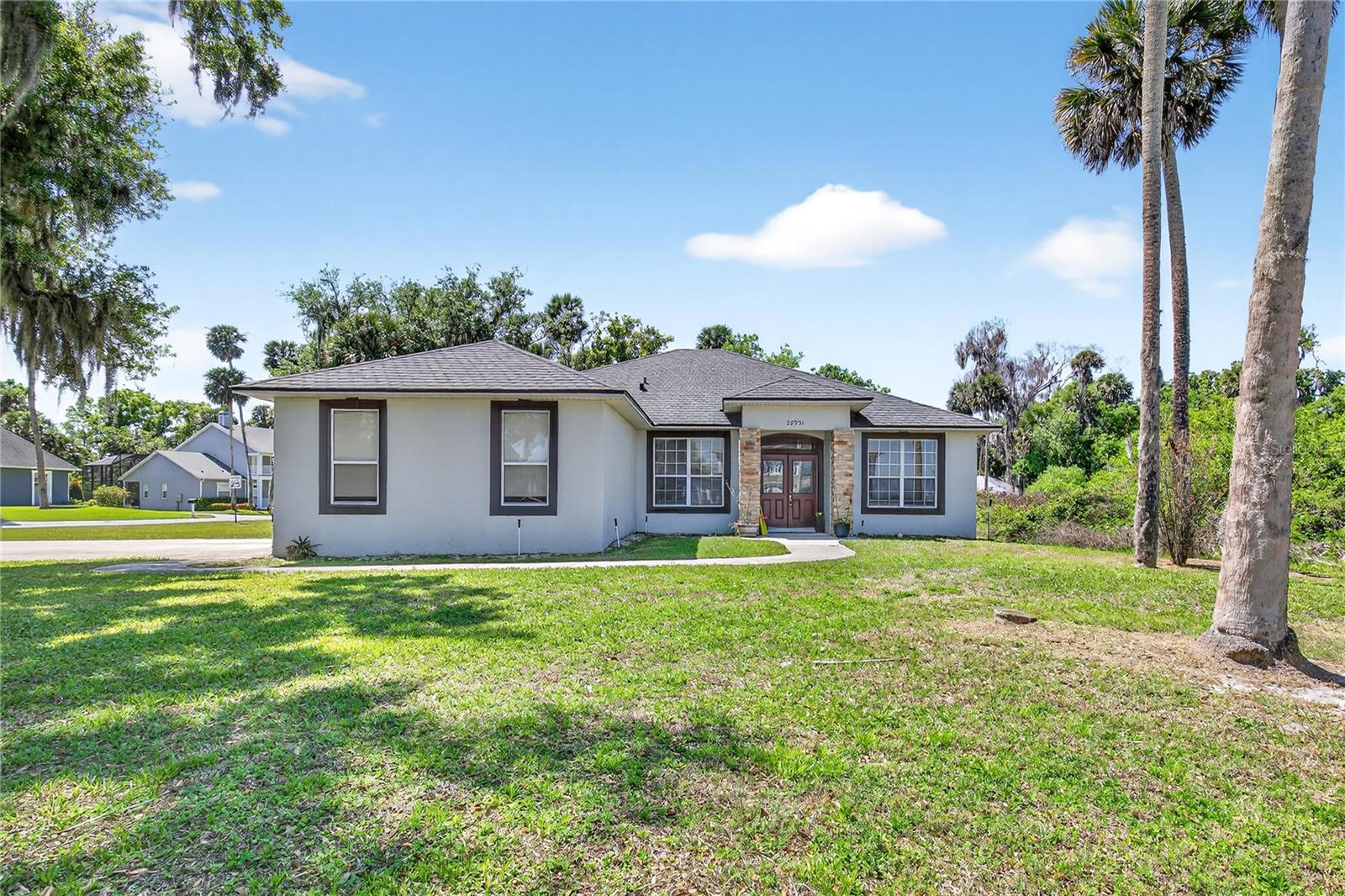 ENJOY THE BEST OF FLORIDA LIFESTYLE IN THIS POOL HOME WITH LAKE VIEWS located in a quiet, highly desirable community on Lake Beauclaire—part of the renowned Harris Chain of Lakes. This intimate neighborhood of just 45 homes offers a peaceful, rural setting with exclusive amenities including a Private Boat Ramp, Fishing Pier, and dedicated Storage Lot for Boats and RVs.





This spacious 4-Bedroom, 2-Bath home is designed for both everyday comfort and effortless entertaining. The open floor plan features Formal Living and Formal Dining Room, both with serene Lake Views, while the expansive Kitchen flows seamlessly into a large Family Room overlooking the screened-in Pool. Sliding Glass Doors provide easy access to the outdoor living space—perfect for hosting gatherings or relaxing poolside.





The home boasts Tile flooring throughout—no carpet—offering both style and easy maintenance. The Primary Suite is a private retreat with a Walk-in Closet, Dual Sinks, a Walk-in Shower, and a luxurious Garden Soaking Tub. On the opposite side of the home, two additional bedrooms share a full bath with convenient pool access, while a fourth bedroom near the interior laundry room is ideal for guests, a home office, or flex space. Roof 2022, AC 2017, Water Heater 2025, Pool Pump 2025, Dishwasher 2025, Range 2025.





Additional highlights include a Side-entry two-car Garage, extended Driveway 2018 with room for four vehicles, and a large corner lot situated on a quiet dead-end street.





Golf enthusiasts will appreciate the short golf cart ride to Deer Island Country Club for a round on the scenic 18-hole course. Conveniently located with easy access to the Orlando area, as well as the charming downtowns of Mount Dora and Tavares—where you can enjoy Seaplane Adventures, Live Entertainment, Waterfront Dining, and vibrant Local Events.





This is Florida Living at its finest—Lake Life, Privacy, and Convenience all in one exceptional property.