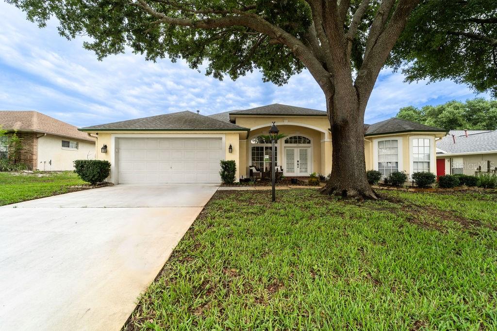 Virtually Staged. Welcome to the highly desirable DeBary Woods community! Filled with natural light and thoughtfully designed living spaces, this charming 3-bedroom, 2 bath home offers comfort, style, and plenty of room to enjoy Florida living. When you step inside you will discover an open and airy floor plan featuring a spacious family room with a cozy gas fireplace, a formal dining room, a bright living room, and a sunny breakfast nook. The well-appointed kitchen is perfect for everyday living and entertaining, offering all appliances, abundant cabinet space, a large pantry, breakfast bar, and gas range. The private primary suite is a true retreat, complete with a lovely bay window sitting area, dual vanities, a relaxing garden tub, separate shower, private water closet, oversized walk-in closet, and direct access to the enclosed Florida room. The Florida room provides additional space to unwind and enjoy the peaceful surroundings. Additional highlights include updated stainless steel appliances, fresh interior paint, a newer A/C system, as well as a finished, air-conditioned garage. Outside, you'll fall in love with the oversized lot perfect for hosting family and friends or simply enjoying a quiet evening outdoors, this inviting space is ideal for relaxation and entertaining. Schedule your private showing today!