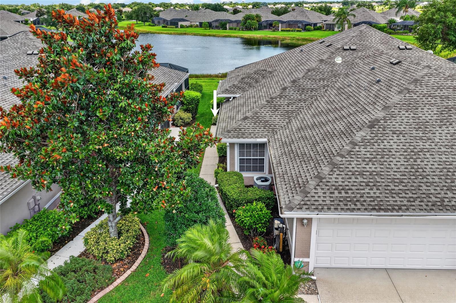 MAINTENANCE-FREE LIVING IN THE HIGHLY DESIRABLE GATED COMMUNITY OF SABAL TRACE! Welcome to this beautifully maintained 3 BEDROOM, 2 BATHROOM, 2 CAR GARAGE VILLA offering comfort, convenience, and picturesque lake views in one of North Port’s most sought-after communities. Combining spacious living areas, quality updates, and resort-style amenities, this home is perfect for year-round residents, seasonal homeowners, or anyone seeking a low-maintenance Florida lifestyle.

Step inside and be greeted by a bright, inviting floor plan featuring tile flooring throughout the main living areas and comfortable carpeting in the bedrooms. Fresh interior paint enhances the home’s clean and welcoming atmosphere, while large windows allow natural light to fill the living spaces.

The kitchen is thoughtfully designed with granite countertops, stainless steel appliances, ample cabinetry, and a functional layout that makes meal preparation and entertaining a breeze. The open-concept design flows seamlessly into the dining and living areas, creating an ideal space for gathering with family and friends.

The spacious primary suite serves as a private retreat and features a walk-in closet and a well-appointed ensuite bathroom complete with a dual-sink vanity and a walk-in tiled shower. Two additional bedrooms and a guest bathroom provide comfortable accommodations for visitors, family members, or a home office setup.

One of the home’s standout features is the extended screened lanai, where you can relax and enjoy peaceful lake views while taking advantage of Southwest Florida’s beautiful weather year-round. Whether you’re enjoying your morning coffee or unwinding at the end of the day, this outdoor living space offers the perfect setting.

Additional features include a NEW ROOF IN 2022 hurricane shutters for added storm protection and peace of mind, as well as a water heater replaced in 2019.

Residents of Sabal Trace enjoy access to outstanding community amenities, including a gated entrance, resort-style community pool, and fitness center, all designed to enhance your lifestyle while providing the security and convenience of maintenance-free living.

Conveniently located near shopping, dining, golf courses, medical facilities, parks, and beautiful Gulf Coast beaches, this exceptional villa offers the perfect combination of comfort, location, and community amenities.

Don’t miss your opportunity to own this beautifully maintained lakefront villa in the highly sought-after Sabal Trace community!