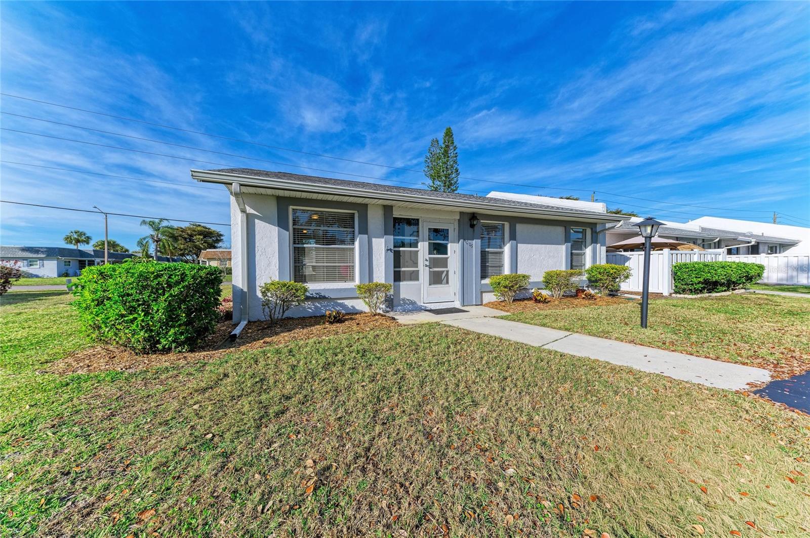 FLORIDA ON A BUDGET...PRICE REDUCTION!!! (Even more) Cost Effective, Amenity rich, Choice Location...Really...and it's an END UNIT?!? Sounds to good to be true, maybe but this Amazing 3 Bedroom 2 Bath Updated Beauty is all of the above...And MORE! From the security screened front door to the recently renovated lanai this unit has a charm that is obvious and features: Luxurious vinyl flooring, an updated Kitchen your household chef will love offering; warm light oak cabinets, classic subway tile back splash, solid surface counter tops and newer appliances. The dining area is perfect for entertaining new found friends or relatives visiting from "up north" to escape the grasp of Ole Man Winter. Your King size bed fits quite nicely in the primary bedroom which features a private bath, the front guest room is separate so overnight guests enjoy privacy and the 3rd bedroom doubles as an inhouse office, craft room or a den where Dad can have his own space to watch the big game or other boring stuff. If you enjoy the outside the lanai is your spot. Newer windows, walls and floors make it additional living space all season long. Cortez Villas has an Active Social Center with a welcoming clubhouse, oversized pool, shuffle board courts and lots of friendly neighbors who enjoy available activities. Located just few miles (6 to be exact) from the beautiful beaches of Anna Maria Island where you can stroll the shore of the Gulf, delight in gentle coastal breezes and enjoy Spectacular Sunsets nightly. Almost instant access to fine dining, shops and groceries you can survive with just a golf cart once you get to town. IF this is your year to put down roots and say goodbye to freezing temps forever, or if you're looking for a seasonal residence so you can head back home to the grandkids for the summer months (ONLY), or maybe you're thinking it's time to make a good investment in the Sunshine state while you wrap things up on your career at home...this could be The One for You. So call today and get Started toward your new Tomorrow!