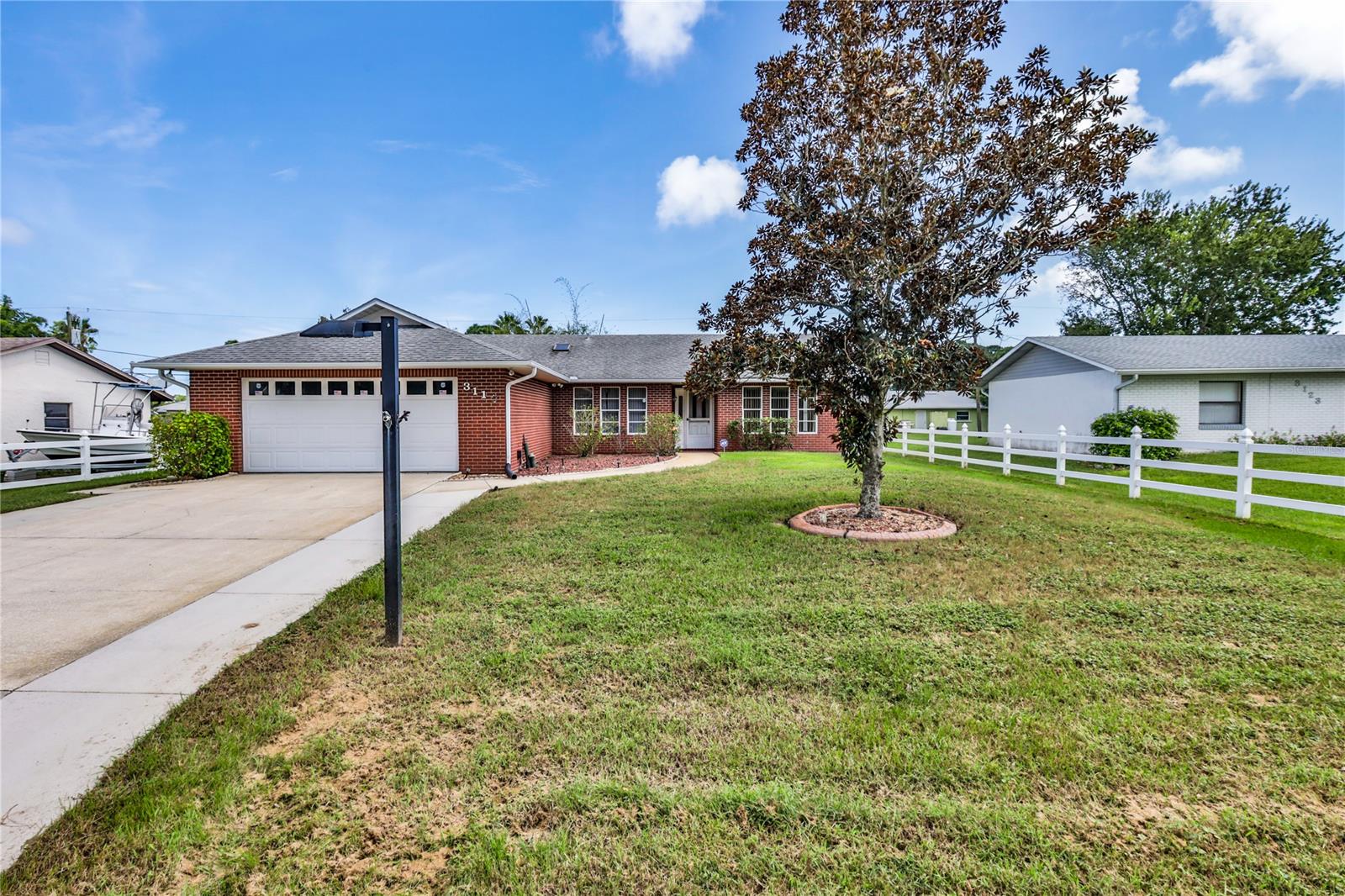 Spacious 3 bedroom 2 bath with vaulted ceilings on a nice size 80x125 lot. Frame house with a red brick tile facade, architectural shingle roof 10 years old. The primary bedroom has a walk in closet and double sinks in the bathroom. Nice open kitchen with all appliances. Screened porch looking out to the fenced backyard. All on a quiet street in Florida Shores, close to shopping, and a short drive to the beach. Lovingly maintained and ready to enjoy! Measurements are approximate. ;Water: City