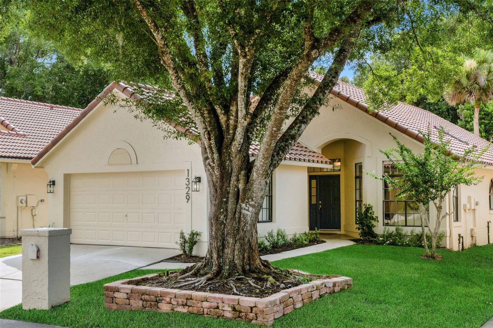 Renovated, remodeled, and reimagined in the highly sought-after Country Club Village at Tuskawilla. This beautifully renovated residence has been thoughtfully transformed with an extraordinary level of quality and attention to detail, delivering a truly turnkey opportunity for today’s discerning buyer - NO EXPENSE SPARED! Extensive recent improvements include a NEW TILE ROOF (July 2025), new gutters, all-new plumbing throughout (2026), fresh interior and exterior paint, and newly textured ceilings throughout, creating a clean, modern aesthetic from top to bottom. Inside, elegance meets functionality with stunning European white oak wood flooring throughout the main living areas, complemented by new carpet in the secondary bedrooms for added comfort. The heart of the home is the beautifully reimagined kitchen, featuring new 42-inch cabinetry, quartz countertops, all-new appliances, and a designer backsplash that adds both sophistication and visual appeal. Entertain effortlessly with a stylish wet bar complete with a beverage refrigerator and matching designer backsplash. Every bathroom has been completely remodeled, showcasing luxurious finishes and quartz surfaces throughout. Additional upgrades include new lighting fixtures inside and out, new door handles and hinges, new plugs and switches, custom roller shades throughout, and a custom closet system in the primary suite. Outside, refreshed landscaping enhances curb appeal and completes this impressive renovation, making this home a rare blend of timeless design, modern luxury, and move-in-ready convenience. The HOA-maintained lawn allows for low-maintenance living, while the location places you just moments from the private Tuscawilla Country Club. Zoned for some of the highest-rated public schools in the state and offers exceptional convenience—just 25 minutes from downtown Orlando, 30 minutes to Orlando International Airport, and less than an hour from Florida’s beautiful beaches and world-renowned theme parks. This property may be under audio/visual surveillance.