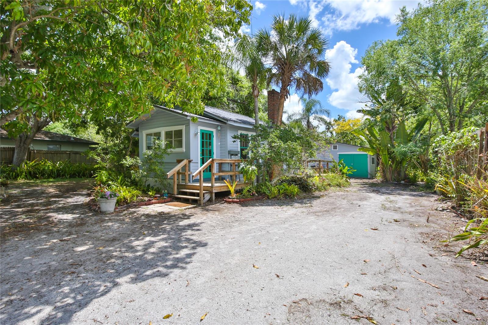 Come see this charming and peaceful Old Florida gem with detached cottage ideally situated in the desirable Indian Beach/Sapphire Shores neighborhood located west of the trail.  Here is a rare opportunity to own two meticulously maintained homes within the city limits in Indian Beach/Sapphire Shores, a community rich with art, culture, and history. This property has been a high-yielding asset for the seller. The seller gets a high volume of applicants, and it has required minimal effort to lease. Picture tree-lined streets, character-filled homes, and being just moments from the shimmering Sarasota Bay. You are in for a treat as you enter the main home through a central air-conditioned enclosed front porch into a home with all of its original, timeless character including glass doorknobs, lovely baseboards and trim, vintage light fixtures, painted heart of pine floors, and functional double-hung windows. This original 1930s home (732 sf) features two bedrooms (freestanding wardrobes), one bath, and a spacious combination dining/living area.  An additional wonderful highlight is the central air conditioned detached guest cottage (478 sf) with kitchen, living area, one bathroom and bedroom alcove along with a screened porch and patio, and attached one-car garage. This cottage is ideal for multi-generational living or Airbnb or full-time lease opportunities.  All furnishings and fixtures convey: the front unit is partially furnished; the back unit is turn-key furnished. The property includes a very nice new 12x16 Tuff Shed ideal for an artist’s studio, workshop, or just additional storage.  Set on a lush 12,000+ square foot lot, the property is spacious with plenty of room for parking, entertainment and other possibilities. You are sure to enjoy the established vegetable and flower gardens. Adding to the charm, you may catch sight of the neighborhood's colorful wild peacocks who love to display their feathers. Excellent location just minutes from the Ringling Museum, SRQ Airport, and downtown Sarasota as well as close proximity to Lido Key Beach, St. Armands Circle, and Siesta Key.  Two high-end homes are currently under construction on the block. This sweet property is waiting to fit your needs whether as live-in residences, a rental investment, multi-generational living, or any combination thereof. This peaceful neighborhood in "Turks Cap" (sometimes referred to as the Museum District) has a rural feel with narrow, tree-lined streets and roaming peacocks. This is a no through street with no traffic. If you want quiet and relaxed, you have found the neighborhood.