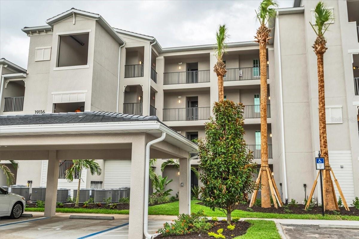 Golf Membership Included during lease terms. 2 Courses; 18 hole and 12 hole courses open. Welcome to Calusa Country Club – Lakewood Ranch’s premier golf and resort-style community. This beautifully appointed Birkdale model Terrace Condominium is the perfect combination of modern design, low-maintenance living, and breathtaking water views. Positioned on the second floor, this residence showcases stunning lake views from the screened lanai, living room, dining area, and kitchen, creating a bright and serene atmosphere throughout. The thoughtfully designed open-concept layout seamlessly connects the kitchen, dining, and living spaces—ideal for entertaining or everyday living. The upgraded kitchen features quartz countertops, stainless steel appliances, designer cabinetry, LED recessed lighting, and an undermount sink, all flowing effortlessly into the main living area. Sliding glass doors lead to the private lanai, true indoor-outdoor Florida living. The owner’s suite is privately located near the foyer, featuring quartz countertops, a walk-in shower with a glass enclosure, designer tile, and modern fixtures, creating a spa-like retreat. A secondary bedroom and full bath flexibility for guests or a home office. Additional highlights include: Washer & dryer included Ceramic tile flooring in kitchen & bathrooms 2" designer window blinds Ceiling fan pre-wiring throughout Smart thermostat & smart door lock Energy-efficient construction & low-VOC paint BUILT FOR FLORIDA LIVING Enjoy peace of mind with hurricane impact windows and sliding glass doors, concrete block construction, tile roof, and a screened lanai with paver patio—perfect for enjoying the lake views year-round. GOLF MEMBERSHIP INCLUDED One of the standout features of this property is the included golf membership, offering exceptional value: Access to the championship course Pay only cart fees when you play A lifestyle that would cost significantly more in comparable communities RESORT-STYLE AMENITIES (CURRENT & COMING SOON) Calusa Country Club continues to grow into one of Lakewood Ranch’s most desirable communities: 18-Hole Championship Golf Course – OPEN 12-Hole Short Course – OPEN Putting Course – OPEN - Satellite Pool - May 2026 Pro Shop – July 2026 Burger Bar – July 2026 Tiki Bar, Resort Pool & Fitness Center – December 2026 Tennis, Pickleball & Bocce Courts – December 2026 Full Clubhouse – March 2027 Golf Simulator – March 2027 With a full-time Lifestyle Director coordinating events, fitness classes, and social activities, this is more than a home—it’s a lifestyle. Whether you’re looking for a full-time residence, seasonal escape, or investment opportunity, this property delivers exceptional value in one of Southwest Florida’s fastest-growing golf communities.