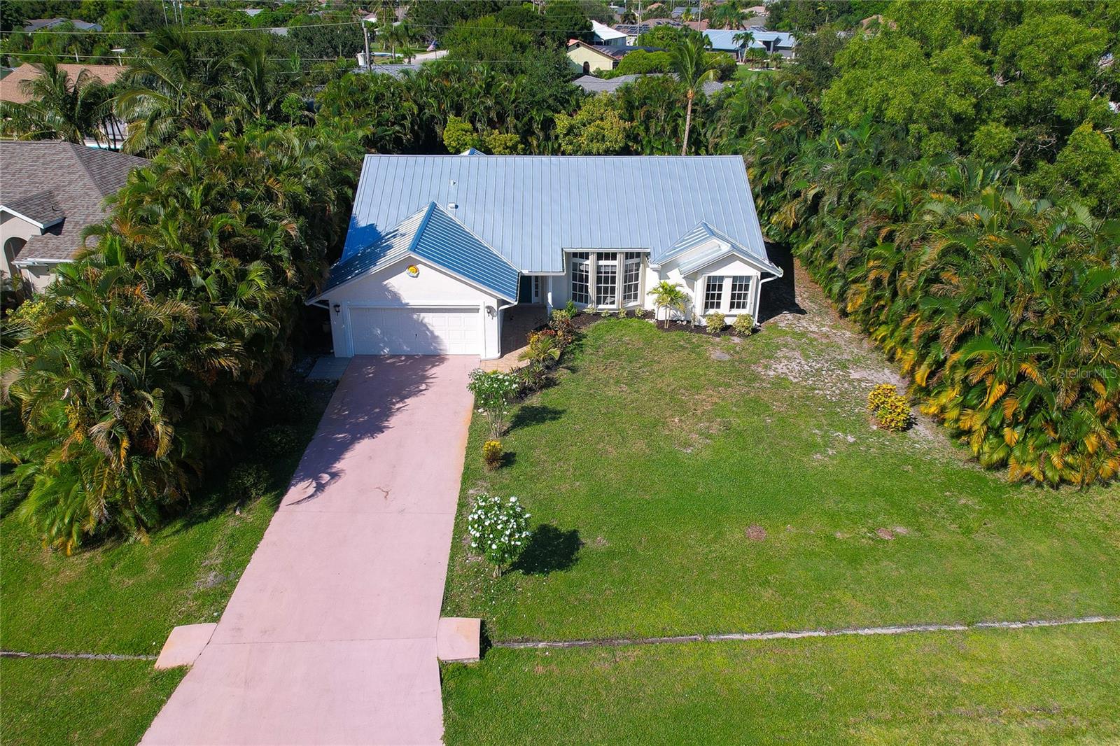 Short Sale. ..Beautiful remodeled 3 bed 2 bath home in great community centrally located on a large lot, just 12 minutes to beach, a walk away from Savanna Preserve. 3 year new AC, custom appliances, vaulted ceilings, split floor plan,  granite counters, custom cabinets, new 50 year seamless metal roof/gutters, beautiful flooring , plenty of natural light and private patio off primary suite that makes this home a must see.