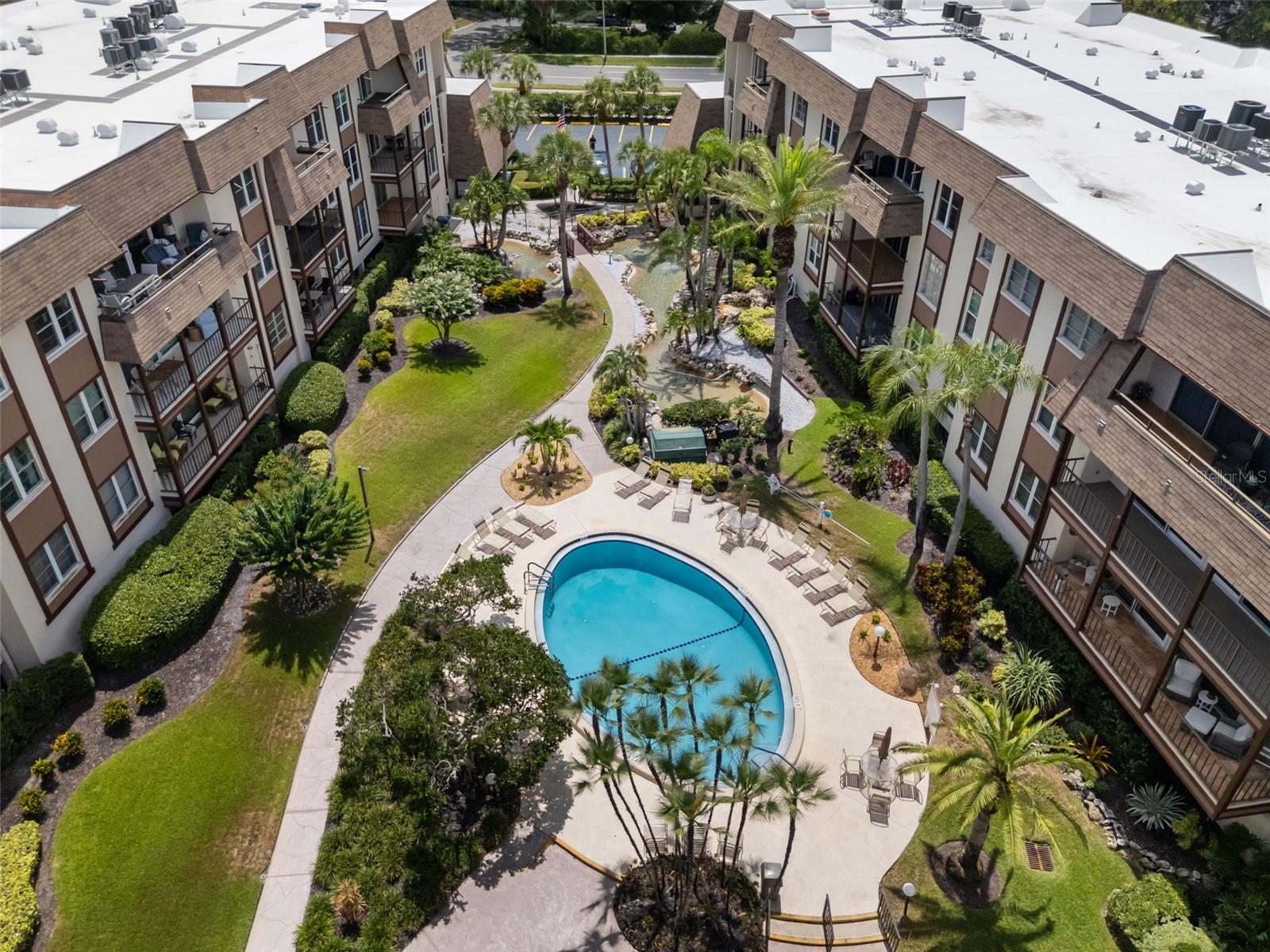 Welcome to Brynnwood at Countryside! Stunningly remodeled in 2022, this spacious 2-bedroom, 2-bath condo offers stylish, move-in ready living in a prime Clearwater location.

The updated interior features new flooring, a beautifully renovated kitchen with abundant cabinetry and a beverage refrigerator, plus a convenient full-size laundry room. Both bathrooms have been tastefully updated, including the primary bath with dual vanities and an upgraded shower enclosure.

Relax on the oversized private balcony overlooking the community's picturesque courtyard, pool, and illuminated fountains. Storage is plentiful with a walk-in closet in the primary suite, two closets in the secondary bedroom, a community storage room, and a private storage closet in the under-building garage.

Additional highlights include assigned under-building parking, elevator access, and an unbeatable location just minutes from Countryside Country Club, shopping, dining, and the Gulf beaches.
