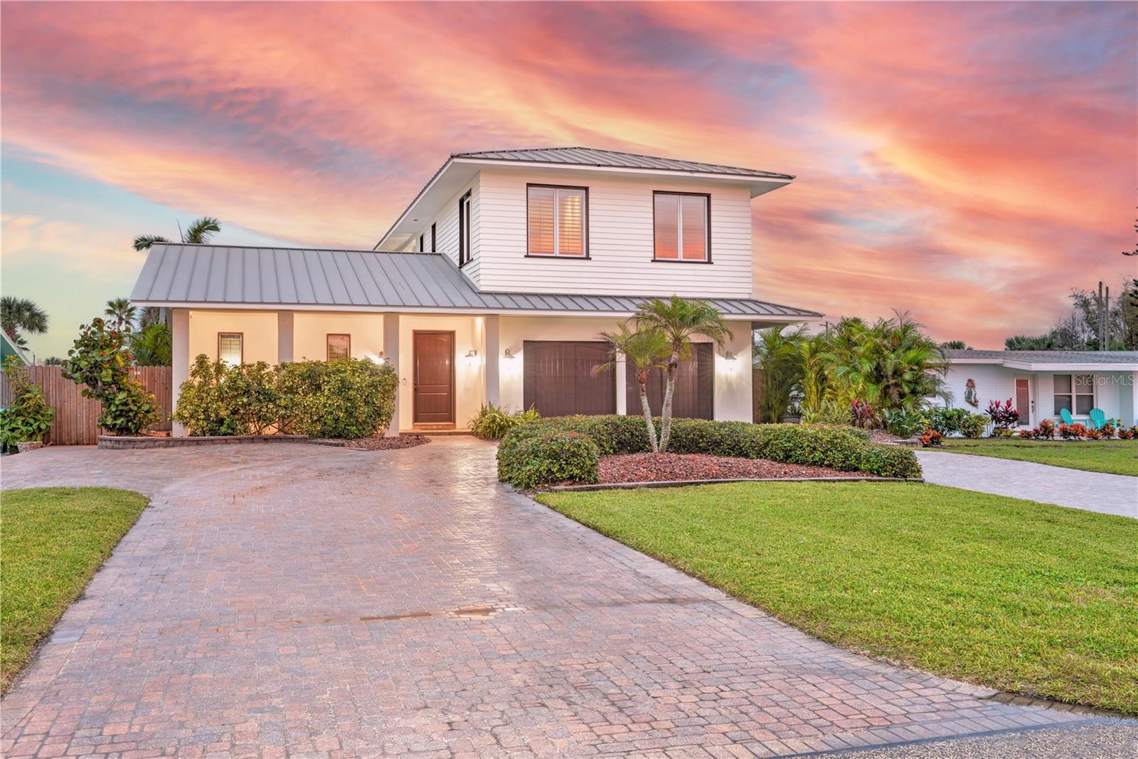 Virtually Staged. This home is offered below its certified appraisal of $1,300,000, presenting a rare opportunity in today’s market. Located in Daytona Beach Shores, where short-term rentals are permitted, it offers excellent Airbnb and investment potential. Custom built by the owner, a licensed subcontractor with an extensive portfolio of luxury estate projects throughout Volusia County, this residence showcases exceptional craftsmanship, attention to detail, and construction quality rarely found. Just steps to the beach, it is conveniently located near a handicapped-accessible beach ramp and vehicle access point. Built to commercial-grade standards, the home features solid poured-concrete walls on all four sides, extra rust-inhibited rebar, and poured concrete balconies and decks. A Sealoflex waterproofing system creates a seamless protective membrane. Additional engineering includes closed soffits for wind-load protection, spray-foam attic insulation with plywood decking, and underground electrical service. No hurricane damage has been reported since its 2008 construction. Recent upgrades include two new A/C systems and propane tankless water heaters (1 year old). The home is serviced by city water and sewer, and includes a high-quality audio and security system. Interior finishes are equally impressive, featuring Ipe (Brazilian walnut) wood flooring upstairs, travertine flooring downstairs, and extensive mahogany trim, cabinetry, plantation shutters, and solid wood doors throughout. Blue-board and authentic plaster walls replace traditional drywall, and bathrooms are finished in slate and shell stone. Coffered mahogany ceilings, custom millwork, and crack-suppressant flooring systems further elevate the home’s quality. Windows and doors include double-pane hurricane-impact Peachtree 140 Series windows, mahogany trim, plantation shutters, impact glass block, and Hafele hardware. Pocket doors are installed throughout. The layout includes 4 bedrooms, an office, game room, living and dining rooms, and 4 full bathrooms. Two bedrooms offer en-suite baths, while a first-floor en-suite provides direct pool access. The office features custom mahogany built-ins and heated granite accents. The chef’s kitchen includes Ecuadorian mahogany cabinetry, granite countertops, dovetail soft-close drawers, lazy Susans, spice racks, and pull-out pantries. The primary suite offers luxury finishes including custom cabinetry, electric fireplace, dual granite vanities, oversized jetted tub, and a large walk-in shower with copper pan and body sprays. Outdoor features include a resort-style pool with Olympic Gold travertine decking and coping, sealed pavers, a circular driveway, stainless steel exterior hardware, and cypress trim. The oversized 2-car garage features high ceilings suitable for car lifts.