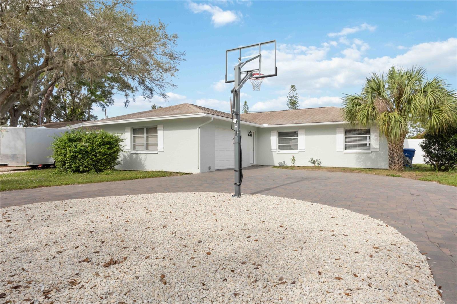 Beautiful home with three bedrooms and two full baths.  Centrally located in Sarasota, light and bright.   Private fenced backyard, no deed restrictions with a Circular Driveway. Washer and Dryer. 1 Car Garage. Ready for Immediate Occupancy.
