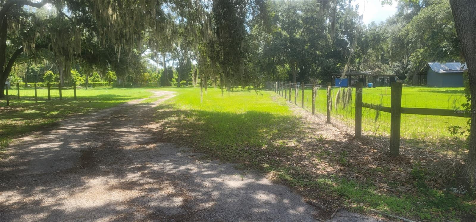 Virtually Staged. Private road, Gated and fenced. Tucked away with Beautiful Spacious Treed Views Vacant Land (electricity, well, septic included). This is what most look for to build a country home.  Horses, goats whatever you wish for your ideas for this AS-1 zoned property.  It is so peaceful and quiet and shaded, just come visit and see for yourself.  Great Price to Start your out of the city but close to the city dreams. Restaurants and Grocery all shopping 5+ minutes and close to I4 and 75hwy. Surrounded by Neighbors that are large acreage private properties.