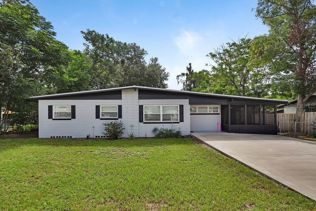 Welcome to 1211 N Boston Ave., where modern updates meet timeless charm in one of DeLand's most convenient locations. This beautifully renovated 3-bedroom, 1.5-bath home has been thoughtfully redesigned from the inside out, offering peace of mind with extensive upgrades completed all the way to the core. Major improvements include a durable metal roof, newer HVAC system, brand-new energy-efficient windows throughout the entire home, all new insulation, and completely new interior walls, making this home feel like new construction while maintaining its original character.

Step inside to an inviting open-concept floor plan that's perfect for both everyday living and entertaining. The spacious kitchen features stunning granite countertops, stainless steel appliances, and ample cabinet space, flowing seamlessly into the living and dining areas.

Enjoy Florida living year-round on the oversized screened-in porch overlooking the fully fenced backyard—ideal for pets, play, gardening, or weekend gatherings.

Located just minutes from the vibrant shops, restaurants, and events of historic Downtown DeLand, you'll also appreciate the convenience of nearby hospitals, schools, parks, and everyday shopping. Plus, with Florida's beautiful beaches just a short drive away, you'll have the best of both small-town charm and coastal living.

Whether you're a first-time homebuyer, downsizing, or searching for a turnkey investment, this move-in-ready home checks all the boxes. With extensive renovations completed from the walls out and major systems already updated, this is a rare opportunity to own a home that's been meticulously rebuilt with quality and longevity in mind. Schedule your private showing today and experience everything this exceptional home has to offer!