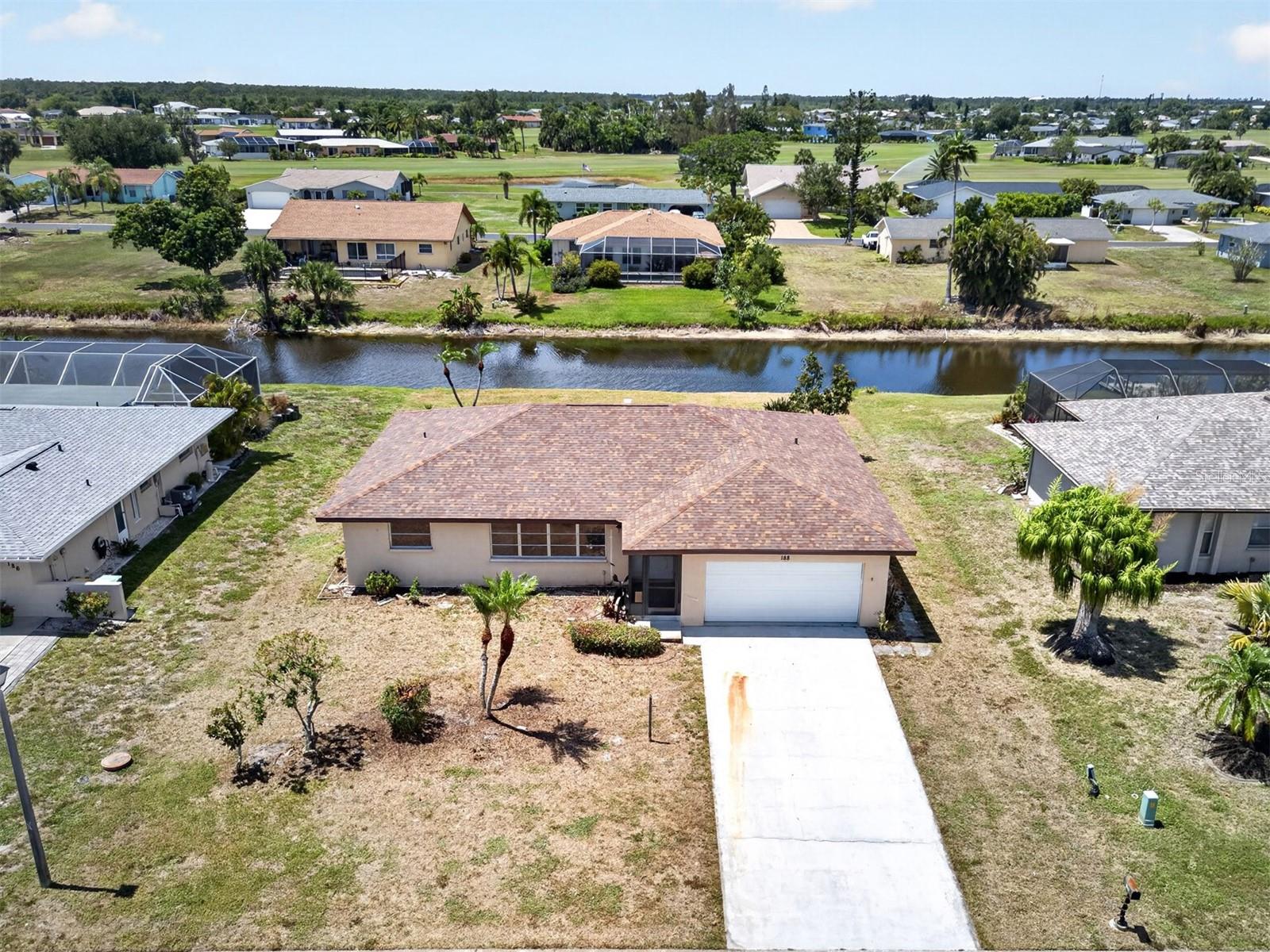 Priced to Sell in Rotonda West Oakland Hills! Great investment opportunity or starter home. 2 bedroom, 2 bath, 2-car garage canal front home on the Cape Haze Peninsula close to numerous golf courses, fishing, boating and beautiful SWFL beaches. Ready for you to bring your own touches. Step inside to an open floor plan with living and family room spaces offering large slider to water views, tile flooring and kitchen with stainless appliances. Split floor plan provides privacy for all with large primary bedroom offering separate office area plus private bath with dual sinks. Lots of potential in the backyard to build the lanai and pool of your dreams. This home includes hurricane shutters with accordion shutter on lanai. Great location close to restaurants, shopping, schools and parks.  Don't miss this opportunity! Schedule your private showing today!