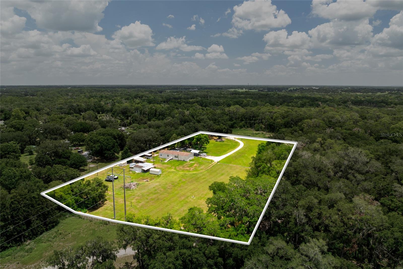 Looking for room to spread out? This nearly 5-acre property offers a rare opportunity in Plant City's rural countryside with agricultural zoning, no HOA, and no deed restrictions. Whether you're dreaming of a small farm, bringing your animals, building your future home, or simply enjoying the privacy and open space, the possibilities are endless.

The property includes an existing manufactured home that conveys as-is, along with a private well and septic system. Surrounded by peaceful countryside and backing up to protected land, you'll enjoy added privacy while still being conveniently located near major roadways, shopping, dining, and everything Plant City has to offer.

Bring your vision and make this unique property your own. Buyers are encouraged to verify zoning, permitted uses, and future development opportunities with Hillsborough County.