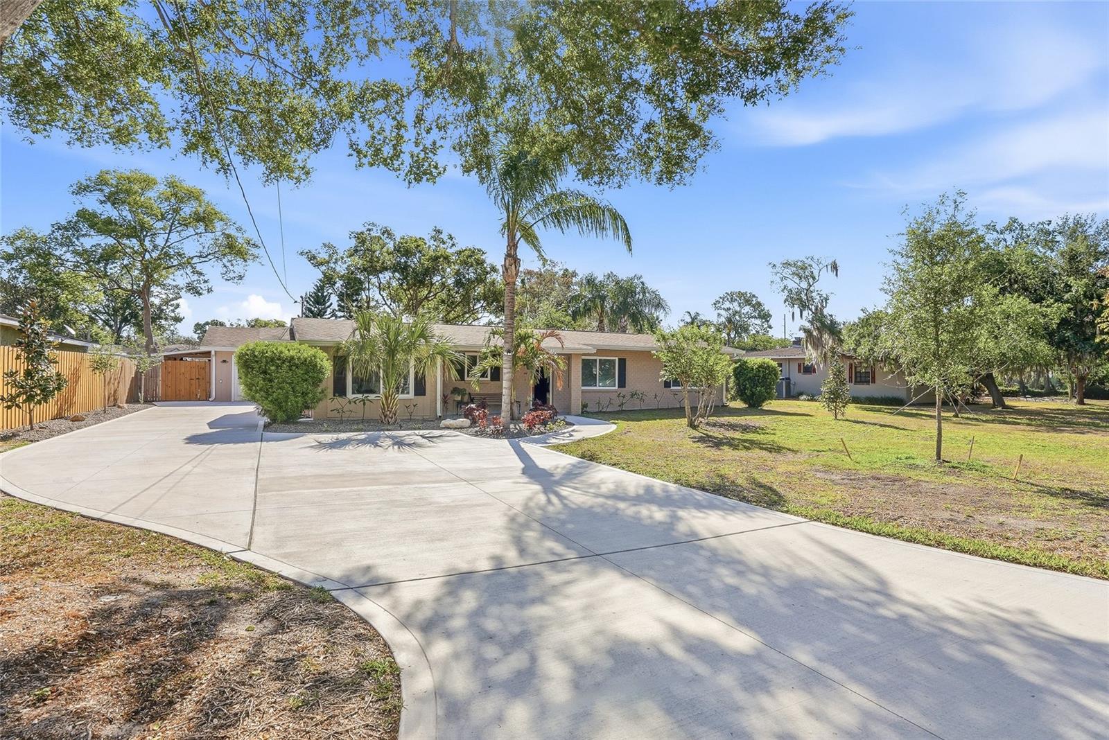 Welcome to this gorgeous home with 1 bed 1 bath detached renovated guest home located in the Forest Hills area of Carrollwood North Tampa — a rare opportunity offering the perfect blend of modern upgrades, versatile living spaces, and true move-in-ready condition. The main residence has been thoughtfully transformed from top to bottom, featuring a complete kitchen remodel with all-new appliances, two fully renovated bathrooms, new flooring throughout, and fresh interior paint and lighting — all within the last three years. Major systems have been comprehensively updated as well, including all-new plumbing, a 150-amp electrical upgrade with generator hookup, a new water heater, and a brand-new A/C and air handler installed in 2025. Peace of mind comes standard here, with hurricane impact windows (2025), a roof just five years old, and a newly updated Florida room and mudroom — each with its own mini-split AC/heat system. Outside, the property shines just as brightly with a new screened patio, new driveway, new fence, fresh exterior paint, new gutters, and a new well water pump and water treatment equipment. The attached workshop has been fully refreshed with new doors, cabinetry, fresh paint, and durable Shark Coat flooring — ideal for hobbyists, contractors, or extra storage. The detached guest house is the crown jewel for buyers seeking multigenerational living or rental income potential. Fully self-contained with one bedroom, one bathroom, a full kitchen with granite countertops and updated appliances, and a comfortable living area, new windows, new carpet, a new water heater, a mini-split AC/heat system, and fresh interior and exterior paint throughout. Whether you're looking for space for extended family, a private home office, or an income-producing unit, this property checks every box. Homes of this caliber — with this level of investment — don't come along often. Plenty of rooms to park or store RV and/or Boat. No HOA homeowners association and not in a flood zone. Check out the video tour on YouTube - https://youtu.be/cLAwqXT7bkQ?si=IL3gGoTBSy1RSfLz