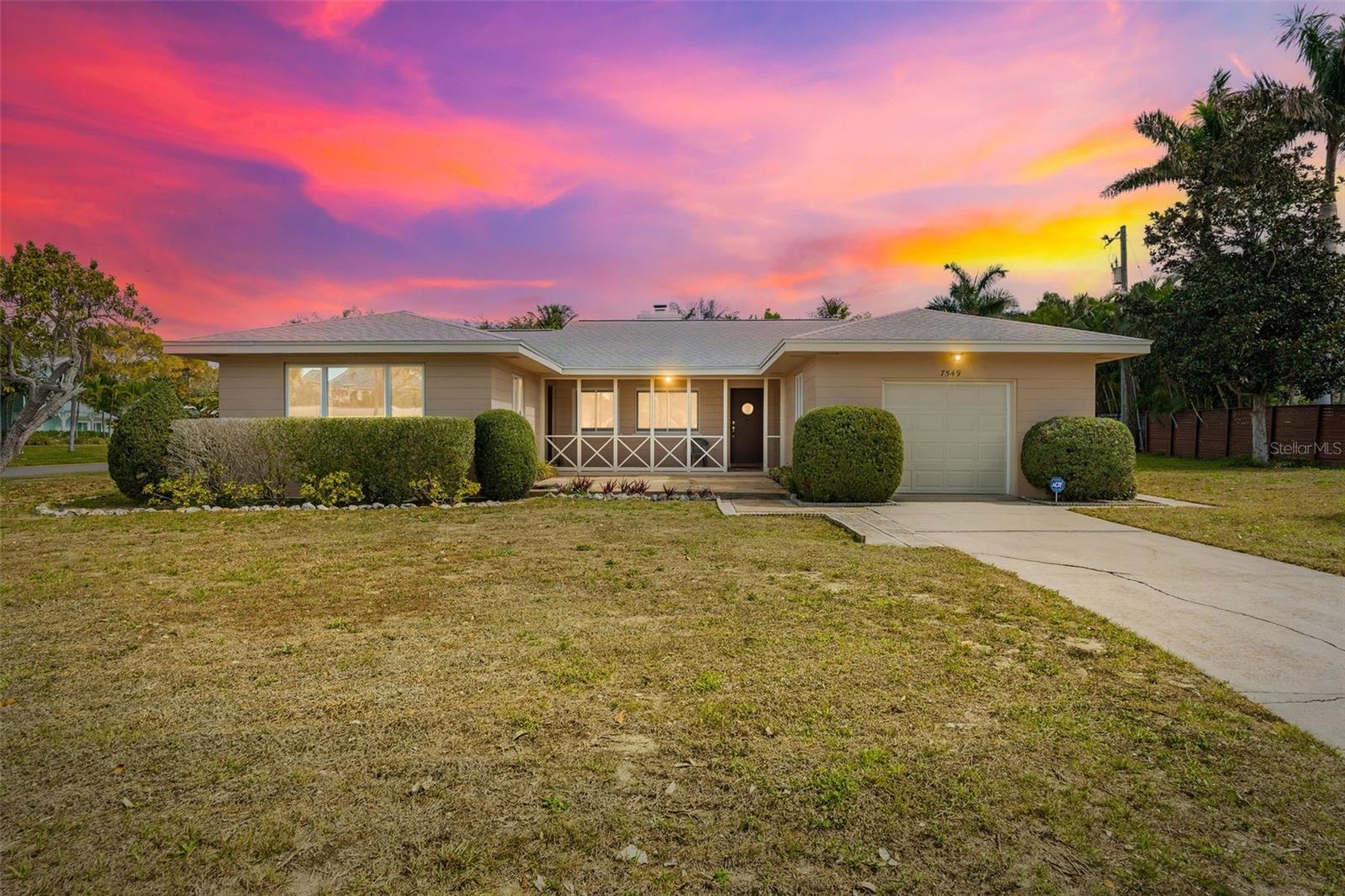 West of the Trail in Whitfield Estates, this mid-century gem captures the charm and character that define classic Florida architecture. From the original terrazzo floors to the preserved kitchen design, the home reflects the clean lines and simplicity that make mid-century residences so desirable.

The spacious great room with fireplace serves as the heart of the home, offering natural light and comfortable gathering space while maintaining its authentic architectural appeal. 
Situated on a rare double lot, the property offers exceptional flexibility and long-term potential. Expand the footprint, design a custom pool, add a detached garage, or simply enjoy the privacy and space that are increasingly rare west of the Trail.
Located on sought-after Westmoreland Drive, just across from multi-million-dollar bayfront estates, this property blends historic charm with premier positioning.
Residents of Whitfield Estates have the unique opportunity to enjoy dining at nearby Sara Bay Country Club. For an optional annual HOA fee of just $35, owners may obtain a culinary membership granting full access to the clubhouse for dining and social events (golf privileges not included; membership subject to club approval).
Minutes to Sarasota Bay, IMG Academy, SRQ Airport, and downtown Sarasota — this is authenticity, land, and lifestyle in one of the area’s most established West of the Trail neighborhoods.