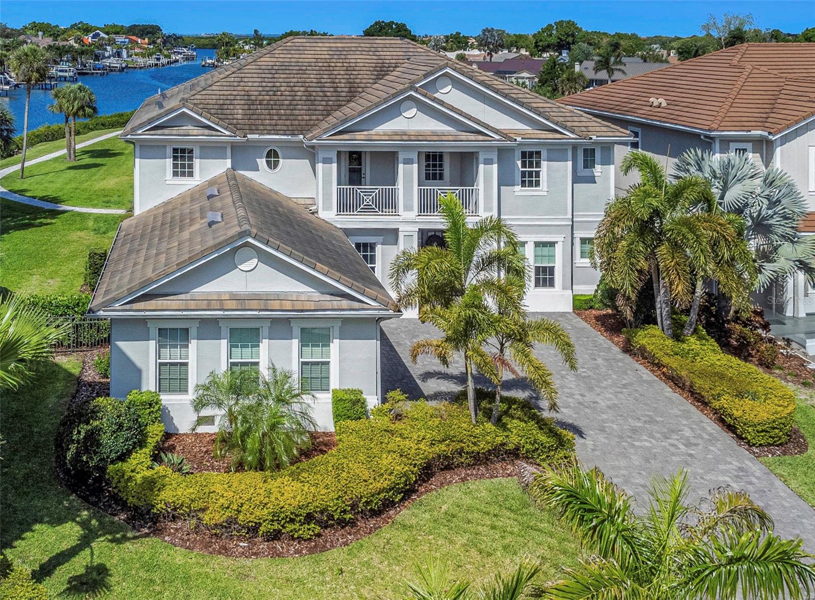 A rare and remarkable offering, this extraordinary waterfront estate presents a once-in-a-lifetime opportunity to own one of Tampa’s most exclusive private residences. Set on over half an acre within a prestigious gated enclave, the property is enveloped by sweeping water views on two sides, delivering an unmatched sense of privacy, serenity, and distinction. Perfectly oriented along an east–west axis, the home is designed to capture breathtaking sunsets from the backyard—each evening unfolding into a spectacular display over the water.
Thoughtfully crafted for elevated living and grand-scale entertaining, the residence showcases five luxurious bedrooms, including two exceptional primary suites, along with two private dens and a spacious bonus room offering endless versatility. Exquisite wood flooring and designer tile extend throughout, complemented by statement chandeliers, bespoke draperies, and refined architectural details at every turn.
A true connoisseur’s feature, the 500-bottle wine cellar anchors the home’s entertaining appeal, while expansive interiors transition seamlessly to the outdoors through an extended lanai—creating a harmonious indoor-outdoor lifestyle synonymous with the finest estates.
Beyond the walls, a private resort experience awaits. The meticulously curated grounds feature a heated pool and spa, an elegant covered patio with awning, ambient landscape lighting, and a fire pit designed for intimate evenings under the stars. A dedicated pickleball and basketball sport court elevates recreational living, while the extended dock invites sunset gatherings, fishing, and effortless enjoyment of the surrounding waterfront.
Ideally located just minutes from Berkeley Preparatory School, Tampa’s premier shopping and dining destinations, and with convenient proximity to Tampa International Airport, this estate offers both seclusion and accessibility without compromise.
This is more than a residence—it is a legacy property, an irreplaceable waterfront sanctuary, and a truly exceptional opportunity for the most discerning buyer.