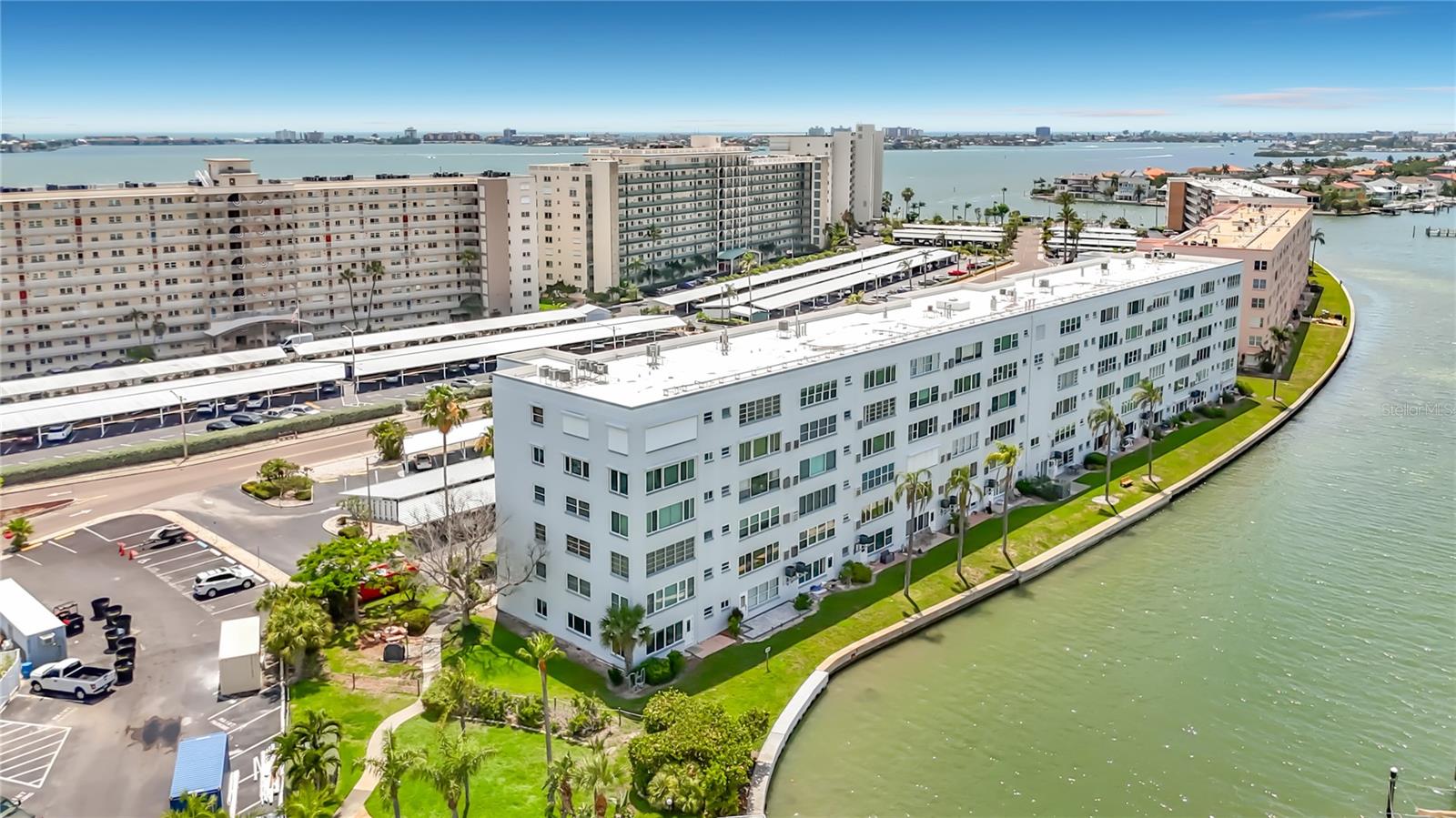 Welcome to this 1st floor unit in Town Shores 55+ Waterfront Community.  Beautifully updated 2 BEDROOM / 2 BATH condo. A new roof was completed in 2025 along with new carports. New electric panel along with new HVAC unit and Hurricane impact Front and Back door along with new appliances & kitchen cabinets. Town Shores sits directly on Boca Ciega Bay. Relax with morning coffee or evening sunset from your Florida room & outdoor patio area with peaceful marina views and dolphins. The many amenities include shuffleboard, billiards, a fitness center, cardroom, tennis and pickleball courts, along with 4 heated pools. The Marina offers boat slips, docks, a kayak launch and fishing. The quaint village of Gulfport is a short stroll to the many restaurants, Tuesday market, shopping, a vibrant nightlife, and Gulfport Beach.