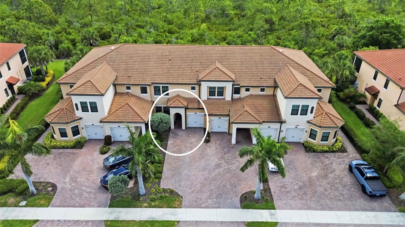 Experience exceptional value in Sarasota National with this beautifully appointed first-floor condominium, now offered at an incredible new price. Featuring 2 bedrooms, 2 full bathrooms, and maintenance-free living, this residence combines comfort, style, and access to one of Venice's most sought-after resort-style communities.

Step inside to discover 9-foot ceilings with crown molding and a bright, open floor plan designed for both everyday living and entertaining. The kitchen serves as the heart of the home, showcasing quartz countertops, stainless steel appliances, a spacious island with seating, a generous pantry, pendant lighting, and an oversized sink.

Thoughtful upgrades are found throughout, including plantation shutters, luxury vinyl plank flooring in both bedrooms, ceiling fans in every room, and a custom walk-in closet in the primary suite. The primary bathroom features dual sinks and ample storage, creating a comfortable retreat at the end of the day.

The built-in entertainment center with electric fireplace creates a warm focal point in the living area, while triple sliding glass doors open to a large screened lanai complete with sunshades and peaceful preserve views. Whether enjoying your morning coffee or relaxing after a day at the beach, this private outdoor space offers the perfect setting to unwind.

Additional features include hurricane impact windows, smart home technology, a decorative front screen door with Ring doorbell, a separate laundry room with extra storage, and a garage with additional parking.

Living in Sarasota National means enjoying an unmatched lifestyle. Residents have access to a 7,000-square-foot fitness center, full-service spa, resort-style pool and spa, tiki bar, coffee lounge, tennis courts, pickleball, bocce ball, dog park, and more. As an Audubon International Certified Sanctuary, Sarasota National provides a unique blend of luxury living and Florida's natural beauty.

The HOA includes water, sewer, cable, pest control, exterior maintenance, irrigation, and full access to the community's world-class amenities.

Conveniently located just minutes from Venice beaches, Historic Venice Island, Downtown Wellen Park, CoolToday Park, shopping, dining, and entertainment, this home offers an outstanding opportunity to enjoy the Florida lifestyle at an exceptional value.

Now priced at just $299,000 - one of the best opportunities currently available in Sarasota National. Schedule your private showing today and discover your paradise.