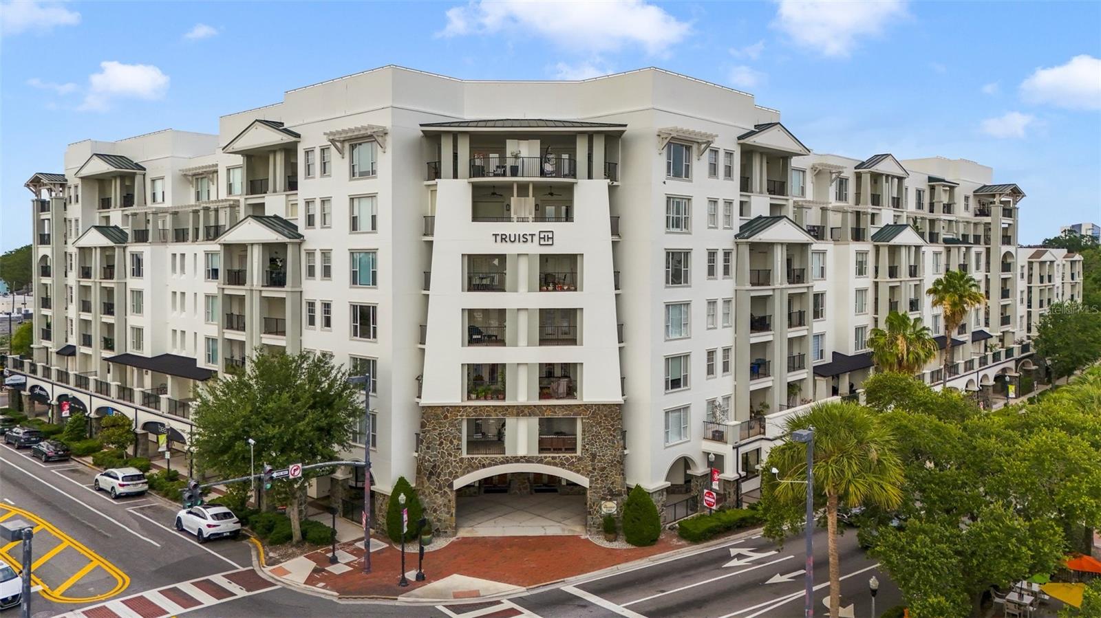 Experience elevated luxury living at The Wellesley, one of Orlando’s premier high-rise residences in the highly sought-after College Park neighborhood. Siting on the second floor, this exceptional corner unit offers nearly 1,800 square feet of living space, showcasing panoramic views through expansive floor-to-ceiling windows and a massive private balcony.

This beautifully appointed residence features 3 bedrooms and 2 1/2 baths, with an open-concept floor plan designed for both everyday comfort and effortless entertaining. The gourmet kitchen is equipped with granite countertops, stainless steel appliances, abundant cabinetry, and a spacious breakfast bar that seamlessly connects to the main living and dining areas.

The luxurious primary suite serves as a private retreat, complete with direct balcony access, a spa-inspired en-suite bath featuring dual vanities, a soaking tub, a walk-in shower, and an oversized walk-in closet.

Residents of The Wellesley enjoy an unmatched lifestyle with resort-style amenities, including 24-hour concierge service, secure building access, a state-of-the-art fitness center, resort-style pool, clubhouse, and secured parking.

Ideally located just minutes from Downtown Orlando, Winter Park, top-rated dining, shopping, hospitals, and entertainment, this residence offers the perfect combination of luxury, convenience, and low-maintenance living. Opportunities to own a spacious corner unit with this level of views, elegance, and amenities are rare.