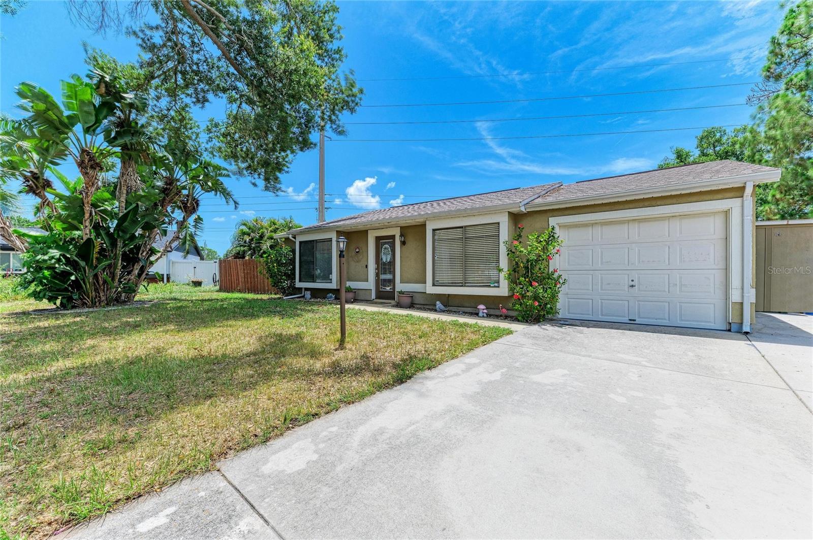 Welcome to 2226 Lockwood Meadows Drive — a rare opportunity tucked away on a quiet cul-de-sac in desirable Sarasota. Situated on an oversized ¼-acre lot, this property offers space, privacy, and flexibility with no deed restrictions, making it an excellent option for both homeowners and investors seeking long-term potential.

Surrounded by mature landscaping, this home feels like a private retreat to enjoy the Florida lifestyle. The expansive west-facing screened lanai is perfect for relaxing evenings and sunset skies, while the sun deck provides additional outdoor living space for entertaining, grilling, or soaking up the sunshine. Garden lovers will appreciate the gardener’s paradise setting, complete with lush planting areas and a newer wood privacy fence for added seclusion.

Inside, natural light pours through charming sitting windows in both the living room and primary bedroom, creating cozy spaces to unwind with a book or morning coffee. Practical upgrades include a 2-year-old roof, extra parking, and the convenience of quick closing with immediate occupancy available.

Location is another standout feature. You’re just minutes from downtown Sarasota’s restaurants, arts, and waterfront, approximately 15–20 minutes to world-famous Siesta Key Beach, about 10–15 minutes to major hospitals including Sarasota Memorial Hospital, and roughly 5–10 minutes to Interstate 75 for easy commuting north or south. Nearby shopping, dining, parks, and schools make everyday living effortless.

Whether you're searching for a primary residence, seasonal getaway, or investment opportunity, this Sarasota gem offers value, location, and endless potential.