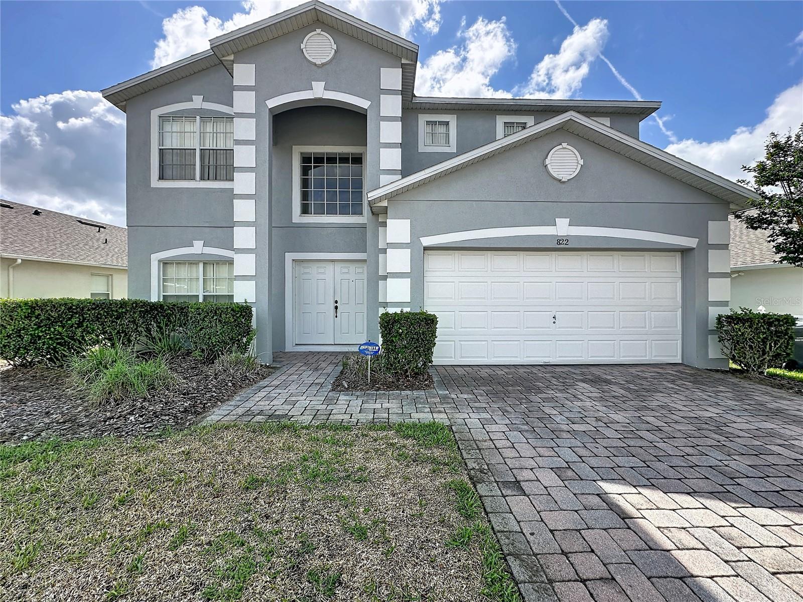 Rare opportunity to purchase a beautifully maintained, fully furnished private pool home in The Sanctuary at West Haven, a privately gated community in the heart of Central Florida’s vacation corridor. Zoned for short-term rental and offering strong appeal as a primary residence, seasonal retreat, or income-producing investment, this home is presented to a high standard throughout and designed for comfort, relaxation, and entertaining. 2022 ROOF, 2019 AC. The spacious open-plan layout features a well-appointed kitchen with center island, generous living and dining areas, and comfortable accommodation for owners and guests alike. The impressive primary suite provides a peaceful retreat with a spacious ensuite bathroom featuring a stand-alone tub and separate shower, along with access to a second-floor balcony offering beautiful sunset views. Outdoors, the southeast-facing private pool and spa create the perfect setting for Florida living, with an oversized pool deck, outdoor shower, poolside half bath, and relaxing views of the greenspace beyond. Whether enjoying sunny days by the pool or quiet evenings after visiting the area’s world-famous attractions, this outdoor space is a true highlight of the home. The Sanctuary at West Haven is ideally located off Ronald Reagan Parkway near ChampionsGate, Reunion, and the Omni Resort, with convenient access to championship golf, dining, shopping, supermarkets, banks, pharmacies, major highways, Walt Disney World Resort, and Central Florida’s renowned theme parks. Community services include gated entry, cable, and lawn care, helping provide a low-maintenance ownership experience. With no CDD, short-term rental zoning, full furnishings, and an outstanding location, this superb home stands out as a compelling opportunity in one of Central Florida’s most desirable vacation home communities. Schedule your private showing today.