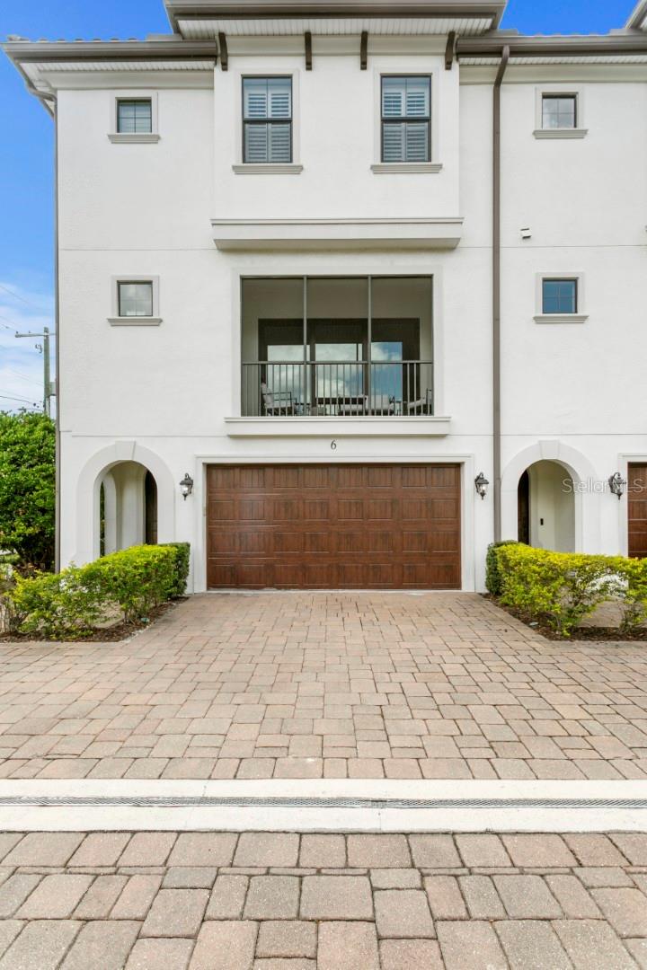 End-unit townhome living in the heart of South Tampa, built by renowned builder Taralon Homes and located in highly desirable Flood Zone X with a low HOA. Offering 4 bedrooms, 3 full bathrooms, 1 half bathroom, a thoughtfully designed three-story floor plan, screened-in balcony and a turfed backyard space! this residence combines functionality, quality construction, and an unbeatable central location close to Downtown Tampa, Midtown, Hyde Park, University of Tampa, Tampa International Airport, shopping, dining, and more.
The first floor features a private guest suite with a full bathroom, an additional flex living space ideal for a media room, office, or gym, and direct access to a fenced backyard. The second level is dedicated to everyday living and entertaining, showcasing an open-concept living and dining area, screened-in balcony, spacious kitchen with gas range, pantry, powder bathroom, and an oversized laundry room. Upstairs, the third floor offers a generous primary suite along with two additional bedrooms and a hallway-accessed bathroom.
Notable upgrades and features include two brand-new air conditioning systems, engineered hardwood flooring throughout with no carpet, plantation shutters throughout, motorized privacy shades in the living room, water softener system, reverse osmosis filtration at the kitchen sink, tankless gas water heater, large 2-car garage, and the added privacy and natural light that comes with being an end unit.  Located within the sought after Mitchell, Wilson, Plant school district!