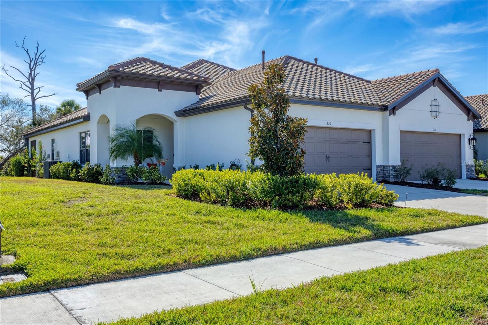 THE FLORIDA LIFESTYLE YOU DESERVE IN AMENITY-RICH VICENZA. The word Vicenza means “victorious” in Italian – here’s your opportunity for victorious living in this active, resort-style community. Casual elegance best describes this PRISTINE 2-BEDROOM, 2-BATH, +DEN villa with a 2-CAR GARAGE, ideally situated on one of the community’s most desirable oversized homesites, offering exceptional privacy and peaceful preserve views. The front porch welcomes you inside. Once in the foyer, just to the left you’ll find double doors to a versatile flex room—perfect for a den or study. The open-concept living, dining, and kitchen area is filled with natural light thanks to 9-foot ceilings and eastern & southern facing windows & sliders. With flooring well-suited to Florida living, you’ll find luxury vinyl plank throughout & tile in both bathrooms—no carpet anywhere. The spacious kitchen features an island with a sink, closet pantry, stainless appliances, timeless Shaker-style cabinetry with crown molding, quartz countertops, and tile backsplash. Three 8-foot pocketing sliders open to the extended lanai with covered and screened areas—ideal for outdoor living. A true split floor plan places the primary suite at the rear of the home, featuring two closets and an ensuite bath with dual vanities. The guest bedroom and bath are located at the front of the home and include a custom Murphy bed with built-in shelving and desk, allowing the space to easily transition between guest accommodations and everyday use. Home features include IMPACT GLASS WINDOWS • NATURAL GAS APPLIANCES WITH HOOKUP ON LANAI • TRAY CEILING • UNDER-CABINET LIGHTING • CEILING FANS • LAUNDRY ROOM CABINETS • LAUNDRY TUB IN GARAGE • EXTENDED LANAI. This villa is PRISTINE & MOVE-IN READY NOW! The neutral color palette combined with the tasteful furnishings complete this home! Be sure to ASK ABOUT THE TURN-KEY FURNITURE PACKAGE AVAILABLE under a separate agreement. Whether you’re looking for a sweet winter retreat or a year-round residence, this villa fits the bill! Vicenza offers resort-style amenities including a pool & spa, clubhouse, pickleball, bocce, dog parks, trails, and activities. This villa is in the x-flood zone and NO FLOOD INSURANCE IS REQUIRED. Residents of Vicenza enjoy LOW HOA FEES and NO CDD FEES. Vicenza is convenient to the Gulf Coast beaches, Venice Myakka River Park, Historic Downtown Venice, Sarasota Memorial Hospital, Atlanta Braves CoolToday Stadium, I75, golfing, boating, fishing, waterfront dining, fine dining, shopping, nightlife & more! DON’T WAIT – SCHEDULE YOUR SHOWING TODAY!