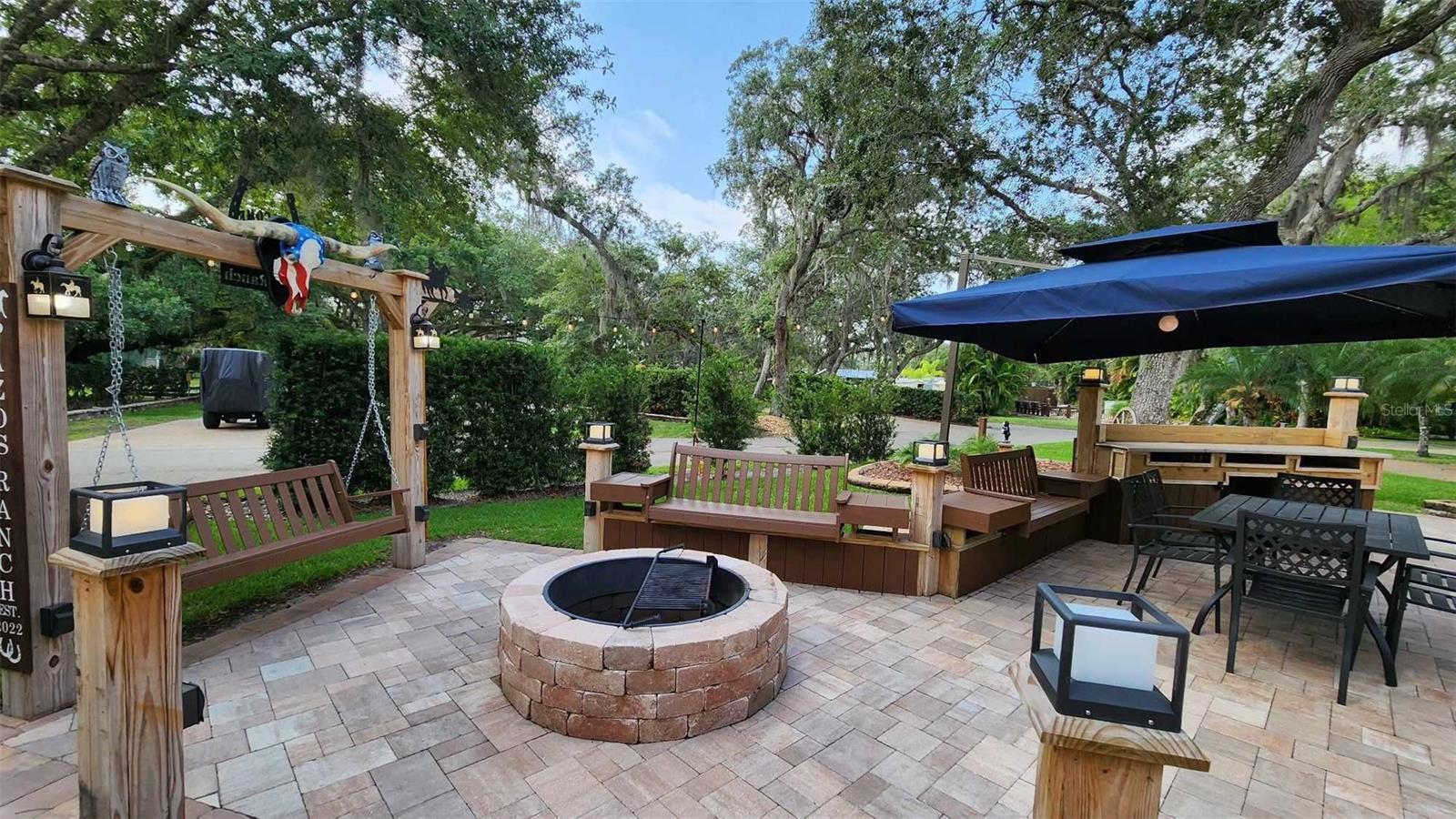 Deeded RV Lot in Central Florida, a perfect Home Away from Home! Welcome to this GORGEOUS Full Hookup Luxury Campsite at River Ranch RV Resort (roughly 1 hr S of Orlando)! Lot size is roughly 4,000sf and has been completely renovated!  Located in PHASE 3, this lot encompasses the entire corner and you own it!!  The sellers installed all new pavers, seating, outdoor kitchen area, firepit area, lighting, landscape and more!  This lot is a WONDERFUL location and is steps from the pool, laundry, bathhouse and pickleball!  All furnishings convey with the sale.  There are gorgeous oak trees that offer shade and lush grassy areas to enjoy!  Plenty of seating, counter top space and storage space as well as a cozy firepit area perfect for enjoying friends, family and campfire smores!  River Ranch RV Resort is perfect for weekend vacations, family camping, seasonal living! River Ranch RV Resort offers beautiful landscaping and privately owned RV lots.  There are many amenities such as Pools, Tennis, PickleBall, Clubhouse, Social Events, Billiards, Poker Room and more!  Enjoy all the amenities of Westgate River Ranch Resort and Rodeo while you camp in paradise! RODEO, SALOON, ADVENTURE PARK, RESTAURANTS, HORSEBACK RIDES, SWAMP BUGGY, PETTING ZOO and more!