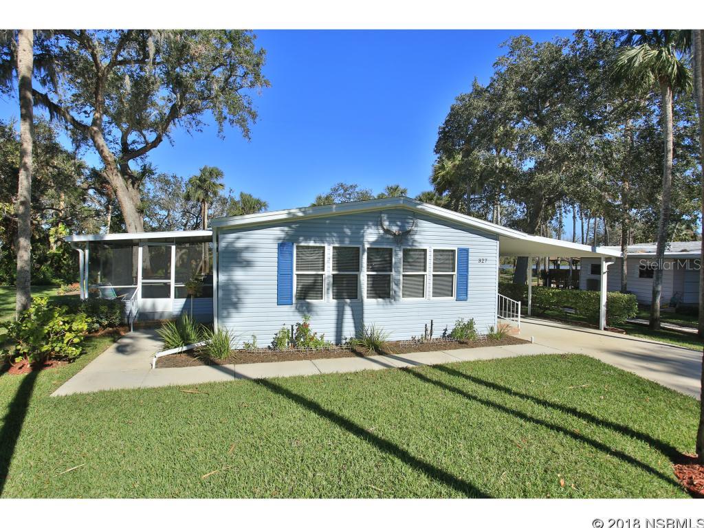 RIVERFRONT HOME IN RIVERFRONT COMPLEX!  Watch the sunrise come up over the Indian River from your super large glassed porch drinking your morning coffee. Or enjoy the sun sitting on the patio.   Riverwalk path is beside of the home leading to the river walk, gazebo and clubhouse. This is one of the best river views in Edgewater Landing.  View can be seen from the kitchen sink also.  Large side screen porch.  Loads of new windows along with the skylights makes the home bright and sunny. Large covered carport.   Open concept.  New Roof June 2017.  Edgewater has SO many amenities.  Just a few is a resident boat ramp to the Intracoastal, Intracoastal fishing dock, heated pool, screen hot tub, tennis, clubhouse with many activities. ;Water: City