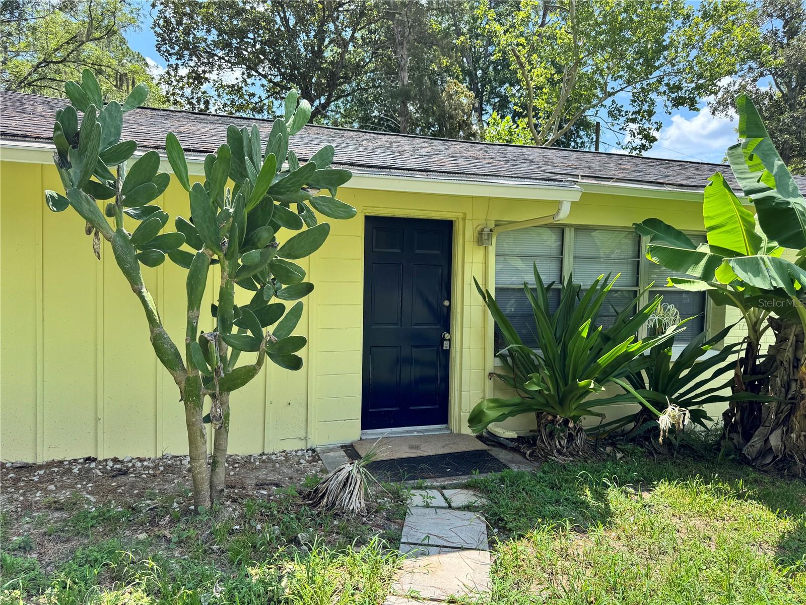 Great opportunity to purchase a clean, move-in ready home with fresh paint inside and out, new carpet, in a fantastic NW neighborhood near the Oaks Mall.  Each of the two bedrooms have huge closets.  The home was originally a 2 bed1 bath home.  The carport was enclosed to create a third bedroom with a massive walk-in closet which provides loads of storage.  The original back porch was enclosed to handle the washer/dryer hook ups, and double as a sizeable office/den.  The living room has windows across the front with a view of the trees across the street.  There aren't any homes on the West side of the road providing a peaceful view.  The 100 x100 foot lot is completely fenced in and includes a separate fenced area for chickens, dog run, play area.  There is a chicken coop ready for you.  The kitchen has the original wood cabinets, oven/range, and a refrigerator.  The roof was replaced in January 2020, and the water heater in July 2026.  This just might be the perfect home for you at a great price!  Great central location in NW Gainesville, minutes to UF, Oaks Mall, North Fl Regional Hospital, VA and Shands