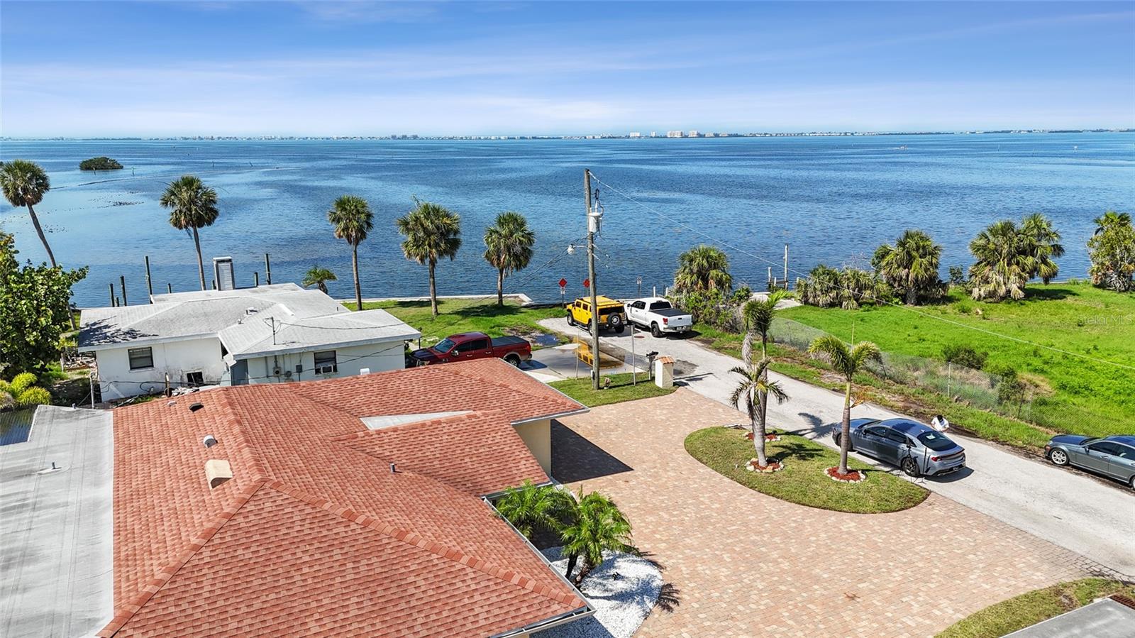 *** Waterfront living at its finest—now priced below recent appraisal for immediate value! ***

This beautifully remodeled 3-bedroom, 3-bath canal-front home offers direct access to Sarasota Bay, positioned just one home in for both convenience and protection. Enjoy stunning sunset views and the ultimate Florida boating lifestyle right from your backyard.

Completely renovated in 2025, this “like-new” residence features a modern open layout with high-end finishes throughout, including 24x24 porcelain tile flooring, a designer kitchen with 42” cabinetry, Samsung stainless steel appliances, and fully updated bathrooms. The flexible floor plan includes two en-suite bedrooms, ideal for guests or extended stays.

Extensive upgrades provide peace of mind, including impact windows and doors, updated A/C systems, and a reinforced enclosed lanai designed for a future sun deck. Roof and seawall are approximately 8 years old.

No HOA. No CDD.

This home is easy to show and available for private tours. Buyers exploring waterfront opportunities are encouraged to schedule a visit and experience the value and location firsthand.