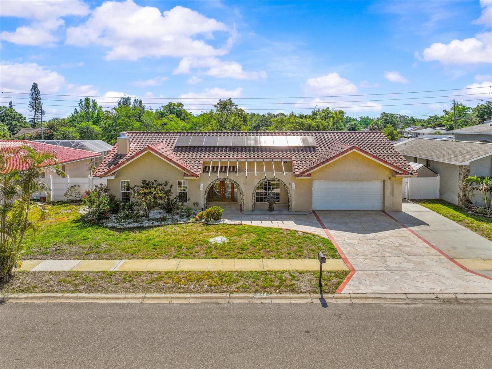 Welcome to this nice 4-bedroom, 2-bath home nestled in a desirable Dunedin neighborhood with no deed restrictions. Offering the perfect blend of comfort, efficiency, and Florida lifestyle, this home features a tile roof (2010), HVAC (2023), and fully paid solar panels—keeping utility costs impressively low. With some small touches this home is move in ready. 
Inside, you’ll find tile flooring throughout most of the home, high ceilings in the great room and primary suite, and a cozy wood-burning fireplace that adds warmth and character. The home is well-protected with hurricane-impact windows and sliders (2022), plus foam attic insulation for added energy efficiency.
Step outside to your private oasis—complete with a fenced backyard and a recently renovated pool and pool area, perfect for entertaining or relaxing year-round. Irrigation runs off a well. 
Location is where this home really separates itself—just 3 miles to Honeymoon Island State Park for award-winning beaches, and 3 miles to Downtown Dunedin, known for its charming vibe, local breweries, restaurants, festivals, and markets. Enjoy easy access to the Pinellas Trail for biking and walking, plus you’re only 2 miles from Westfield Countryside Mall, Whole Foods Market, and a new Target location nearby.
