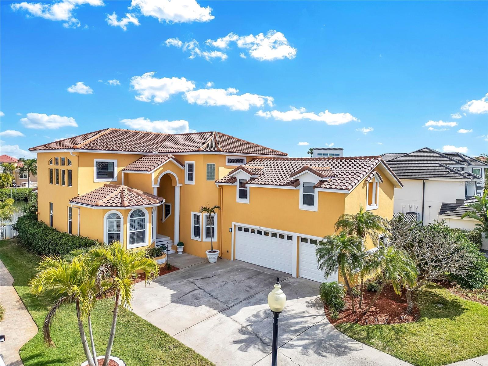 Fully remodeled inside and out, this luxury smart home is located in an exceptionally secure gated neighborhood. The extensive remodeling was completed in 2026 and includes a brand-new tile roof with warranty, both AC units under warranty, a new kitchen, and fully renovated bathrooms. Updates include all new kitchen cabinetry and appliances, illuminated quartzite countertops, new bathroom vanities, toilets, fixtures, and vanity tops, energy-efficient lighting, new flooring, fireplace, smart switches, updated boat lift, and fresh interior and exterior paint.
Experience waterfront living in this stunning 4-bedroom, 3-bathroom home with a private dock and breathtaking canal views. Designed to impress, the home features soaring 24-foot ceilings with gorgeous chandeliers, an elegant electric/gas fireplace, and beautiful luxury bamboo flooring paired with extra-large tile throughout. The brand-new custom kitchen is a true centerpiece, showcasing natural illuminated quartzite countertops, custom cabinetry, along with all new appliances including three refrigerators and a full-size wine cooler—perfect for entertaining.
The thoughtfully designed layout offers unique and versatile living spaces. One bedroom includes a loft area perfect for little ones to play or sleep, while an additional bonus suite with its own staircase provides a completely private living area featuring a large living space, bedroom, full bathroom, and spacious walk-in closet with potential for kitchen conversion—ideal for guests, multi-generational living, or a private retreat.
The private master retreat features its own staircase leading to the primary bedroom and adjacent loft, perfect for a home office or lounge, along with a balcony overlooking spectacular canal sunsets.
Including underground gas tank with a dedicated line for your outdoor grill. Boating enthusiasts will appreciate the recently installed boat lift with 15,000-lb capacity. Very low HOA fees include 24/7 security guard, gated entry, community pool, playground, private beach, and clubhouse.
