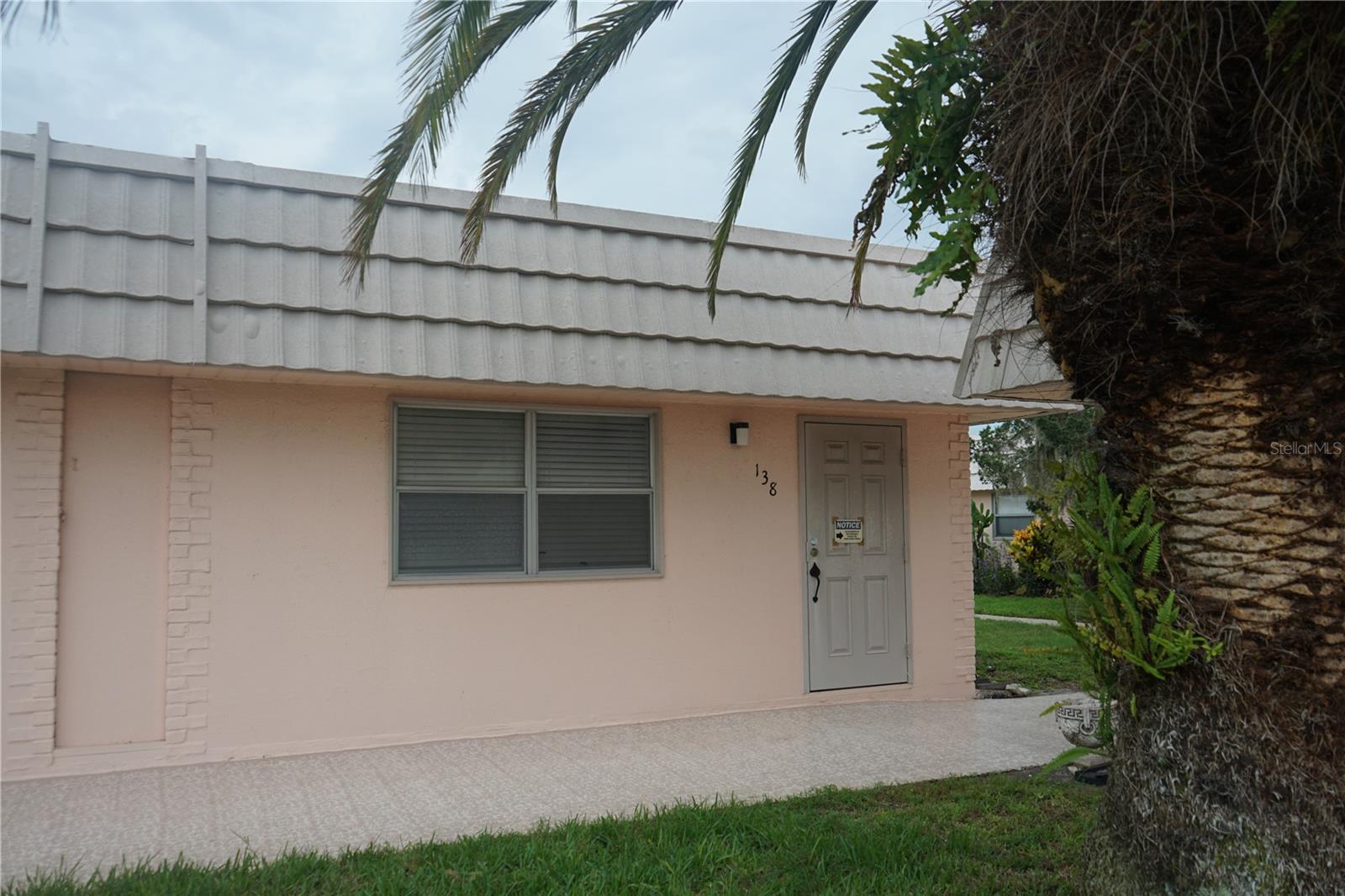 PET FRIENDLY !! One pet allowed under 20 pounds in the 1 bedroom condo close to the north clubhouse where all the action happens. The home has all laminate floors for easy cleaning and has just been painted white with a soft blue tone and new blinds so it's ready for you to move in. The living and dining room share space and the kitchen is adjacent and has a tall pantry cabinet for extra storage. The hallway has a closet and half bath then you enter the bedroom complete with a full hath and the laundry in the closet. The back lanai is screened in so you can enjoy the fresh air with your covered carport near the back door. Kings Point has plenty of things to keep you busy and the monthly fee here covers just about everything.
