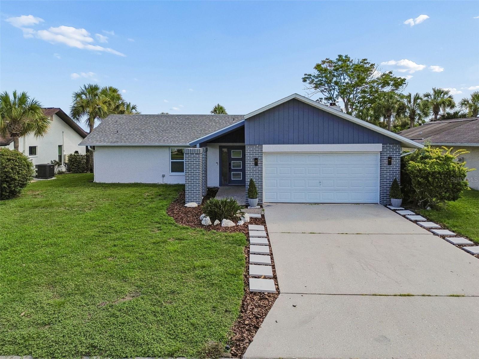Welcome to this spacious REMODELED 2-bedroom, 2-bath home in the desirable Gulf Harbors Woodlands community! Offering over 1,600 square feet of living space, this well-designed residence features a split-bedroom floor plan, soaring ceilings, an inviting eat-in kitchen, and a cozy wood-burning fireplace that creates the perfect gathering space. The generous primary suite includes a walk-in closet and private en-suite bath, while the second bedroom provides comfort and privacy for guests or a home office. Sliding glass doors lead to a large screened rear porch, ideal for relaxing or entertaining while enjoying Florida’s year-round sunshine. This room can easily convert to a third bedroom. Additional highlights include an attached two-car garage, mature landscaping, and a quiet Cul de sac. Residents of Gulf Harbors Woodlands enjoy access to a community pool, tennis courts, recreational facilities, and golf cart-friendly streets. Optional membership to the Gulf Harbors Private Beach Club provides exclusive access to a beautiful private beach on the Gulf of Mexico.
Conveniently located near shopping, dining, medical facilities, parks, marinas, and the vibrant downtown New Port Richey waterfront, this home offers the perfect combination of comfort, community, and Florida lifestyle.