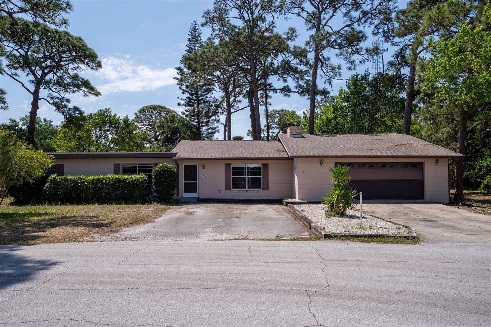Opportunity awaits you!  This 3 bedroom, 2 bathroom home is a renovators paradise.  There are two Parcel ID’s included in the purchase price that total 1.33 acres. Both parcels are zoned MH-5, Urban mobile home zoning classification.  One mobile home, single family standard or manufactured modular home is permitted. This is a cash sale and is being sold as is.  Location is key!  Just minutes from the public boat ramp, shopping, restaurants, and the beach.  Schedule your showing today, this will not last long!
