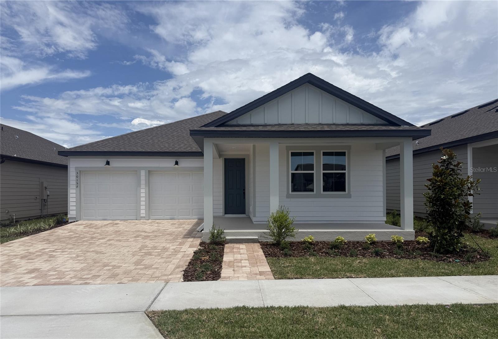 Under Construction. Discover effortless Florida living in this beautifully designed Douglas II home, inspired by the AW Collection Artisan, located in the desirable Trailside community of Mount Dora. This single-story residence offers 3 bedrooms, 2 baths, and a 2-car garage, thoughtfully crafted for comfort and modern style. The open-concept floor plan is filled with natural light and features 42" neutral-toned cabinets, stainless steel appliances, and a large island with upgraded quartz countertops, making the kitchen ideal for both everyday living and entertaining. Wood-look luxury vinyl plank flooring enhances the main living areas, while the bedrooms feature upgraded carpet for added comfort. Residents of Trailside enjoy access to community amenities including a resort-style pool, clubhouse, and playground. Ideally situated near top-rated schools and just minutes from the charming shops and restaurants of historic downtown Mount Dora, this home offers the perfect blend of convenience, style, and community living.