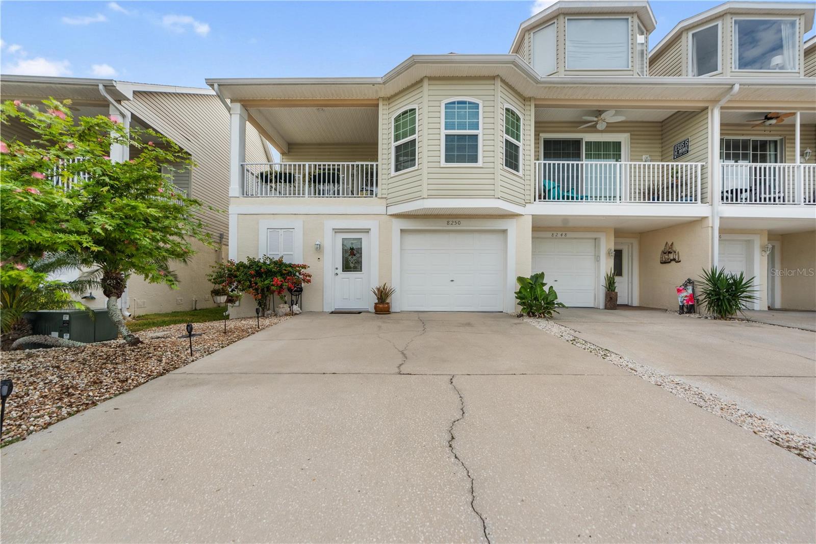 Welcome to Sand Pebble Townhomes, a highly desirable waterfront community in Port Richey, where residents enjoy a relaxed coastal lifestyle, community amenities, and convenient access to shopping, dining, parks, and local attractions. This well-maintained townhome offers the perfect combination of comfort, convenience, and low-maintenance living.

The home has been thoughtfully updated with major mechanical improvements, including a 2-year-old HVAC system and a 2-year-old water heater, providing efficiency and peace of mind for years to come.

Additional upgrades completed within the past year include a screened patio enclosure, a whole-house water filtration and water softening system, and a premium Speed Queen washer. These improvements enhance both everyday living and the overall value of the home.

One of the property's most significant features is the complete replacement of all windows with hurricane-rated impact windows installed this year and backed by a transferable warranty. Offering superior storm protection, improved energy efficiency, enhanced security, and noise reduction, this major investment makes this move-in-ready Sand Pebble townhome a standout opportunity on Florida's Gulf Coast.