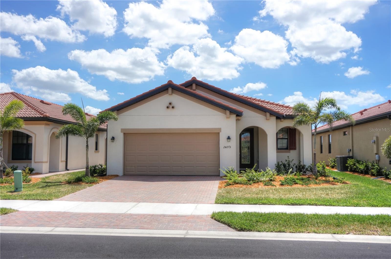 This home just built in 2022 and now available for quick move in. The popular MILAN floor plan 2BD/2BA/DEN/2CG with LAKE AND GREENSCAPE VIEWS, NO HOUSES BEHIND YOU!!! PLENTY OF ROOM TO ADD YOUR OWN PRIVATE POOL!! Open floor plan with tons of windows and light- bright and sunny with SOUTHWEST exposure. That means spectacular SUNSET VIEWS! Covered lanai to sit and watch the Florida wildlife. Plenty of room to add a pool. Property is being offered TURNKEY! TWO FULL GOLF MEMBERSHIPS COME WITH THIS HOME!! Open floor plan with rectangular tile flooring throughout main areas and carpet in the bedrooms. Crown molding in main areas. Spectacular kitchen with granite counters, stainless steel appliances, back splash, upgraded raised panel cabinets, Island with counter height seating. Separate Den area, formal living room space, or whatever your needs might be. Separate dining area for more formal gatherings, family gatherings, or game night. Master bedroom with en suite bath overlooks spectacular view. Master bath offers dual sinks and large walk in shower, walk in closet. Guest bedroom and bath at other end of home for privacy Sarasota National is a marvelous community with over 1300 acres designated for preservation, conservation, lakes, and open space with amazing views, Proclaimed as an Audubon International Certified Sanctuary, making it the most gorgeous and enjoyable golf course to play at in the area. Offering resort style amenities with huge resort style pool and spa,Tiki Bar to serve refreshing drinks and a bite of lunch, tennis courts, pickle ball, Bocce courts, coffee lounge/library/card room/meeting place, 7000 sq ft fitness facilities offering classes and day spa, and a 30,000 sq ft Clubhouse with dining and spectacular views. 18 Hole championship golf course surrounded by native wetlands and preserves provides an exhilarating and dramatic back drop for your golfing adventure. Minutes away from the new Wellen Park shopping area and Atlanta Braves stadium. Venice Beach and Venice Downtown are just a short drive. Your choice of restaurants and outdoor activities await. Come find YOUR Florida lifestyle TODAY and Live everyday like your on vacation!