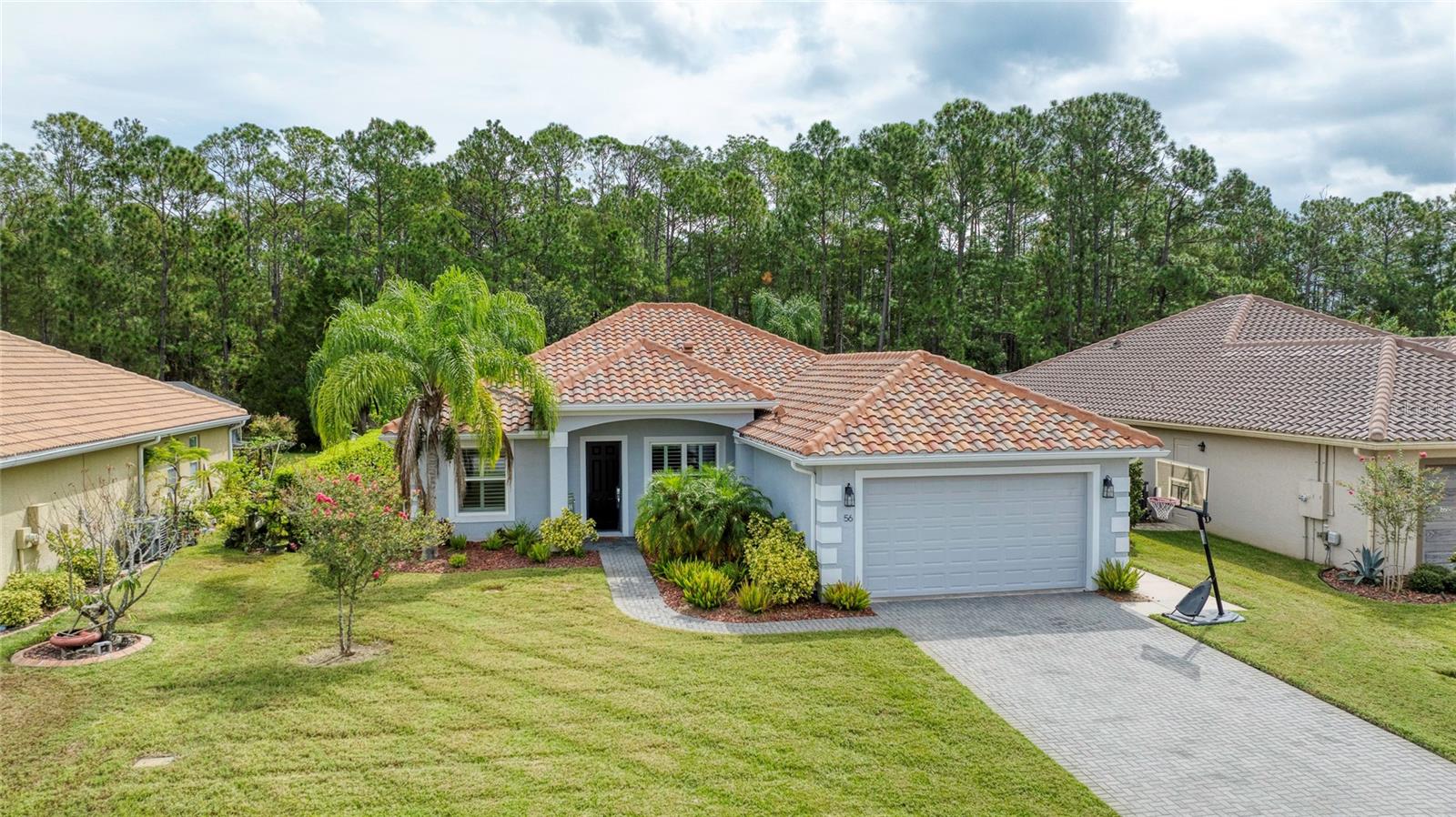 This thoughtfully designed residence combines low-maintenance living with high visual appeal offering a layout that feels spacious & refined within every room. The home features a durable tile roof, providing years of worry-free protection, & a newer construction design situated in a quiet enclave branching from the larger Hunters Ridge community. Residents enjoy access to exceptional amenities including two pools, a clubhouse, tennis courts, playground & more. Inside, artful wood-look tile flooring enhances every space, balancing elegance with functionality. A highlight of the property is the 570 sq. ft. garage, purposefully planned with an industrial fan & utility sink--ideal for creating a productive woodshop, automotive workspace, or even additional project or cooking space. Outdoor living is equally impressive with a 310 sq. ft. screened patio that embraces a natural backdrop of lush woods & treed landscape, offering privacy & a serene setting on all sides. Added conveniences

This thoughtfully designed residence combines low-maintenance living with high visual appeal offering a layout that feels spacious & refined within every room. The home features a durable tile roof, providing years of worry-free protection, & a newer construction design situated in a quiet enclave branching from the larger Hunters Ridge community. Residents enjoy access to exceptional amenities including two pools, a clubhouse, tennis courts, playground & more. Inside, artful wood-look tile flooring enhances every space, balancing elegance with functionality. A highlight of the property is the 570 sq. ft. garage, purposefully planned with an industrial fan & utility sink--ideal for creating a productive woodshop, automotive workspace, or even additional project or cooking space. Outdoor living is equally impressive with a 310 sq. ft. screened patio that embraces a natural backdrop of lush woods & treed landscape, offering privacy & a serene setting on all sides.