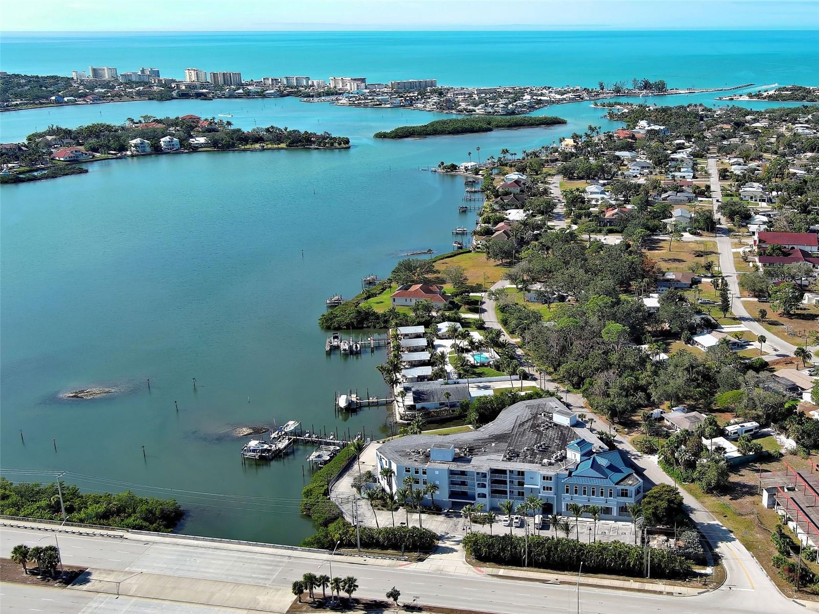 LUXURY WATERFRONT LIVING | COMPLETELY REMODELED CONDO WITH PRIVATE BOAT SLIP

Discover refined waterfront living in this completely remodeled luxury condo offering over 1,800 square feet with 2 bedrooms and 2½ bathrooms. From the moment you enter, you are welcomed by abundant natural light, a striking wall of windows and sliding glass doors, and soaring ceilings that create a bright, open atmosphere.
This residence has been thoughtfully upgraded throughout, featuring new large-format concrete-look tile flooring, new interior paint, designer lighting fixtures, and new ceiling fans. The stunning new kitchen is complemented by all-new appliances, while additional updates include new interior doors, upgraded baseboards, and trim. Impact windows and doors provide peace of mind while enhancing energy efficiency and quiet comfort.
The spacious primary suite offers sliding glass doors with breathtaking water views and a spa-inspired en-suite bathroom featuring a luxurious wet area with soaking tub, new vanity, toilet, and mirror. The second bedroom includes its own beautifully remodeled en-suite bath, ideal for guests, while the elegant half bath is highlighted by a dramatic full wall of tile.
Step outside to the large covered balcony and enjoy spectacular sunset views over the water. Boating enthusiasts will appreciate no fixed bridges and the convenience of a private boat slip. Ideally located just minutes from Nokomis Beach and Historic Venice Island, this exceptional residence delivers upscale, maintenance-free living in a premier coastal location.