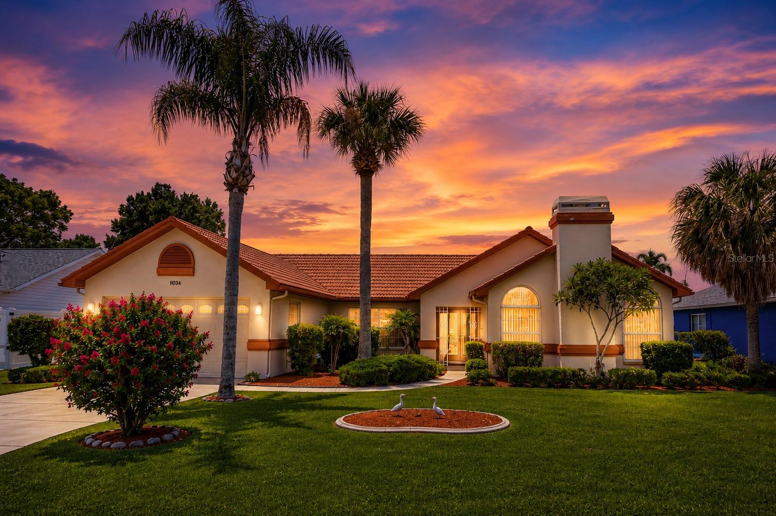 Welcome home to this meticulously maintained Cecil Built Homes Cheyanne II Model, offering 3 bedrooms, 2 full bathrooms, a 2 car garage, and 2,012 square feet of thoughtfully designed living space. Step inside to soaring vaulted ceilings, a separate formal dining room, and a spacious eat-in kitchen with a charming breakfast nook overlooking the backyard. The large sunken living room is the perfect place to gather, featuring a cozy wood burning fireplace. The private primary suite offers a walk in closet, dual vanities, a relaxing garden tub, and a separate walk in shower. Step outside to your own backyard retreat where an expansive screened lanai surrounds a sparkling in-ground pool complete with a tranquil running fountain-ideal for entertaining or simply unwinding.  Additional highlights include a sprinkler system, attached 2 car garage with door opener, and mature landscaping. Best of all, there are no HOA fees and NO deed restrictions, giving you the freedom to truly enjoy your property. Conveniently located near shopping, dining, schools, medical facilitie, and the Suncoast Parkway for an easy commute. Don't miss the opportunity to make this exceptional home yours!