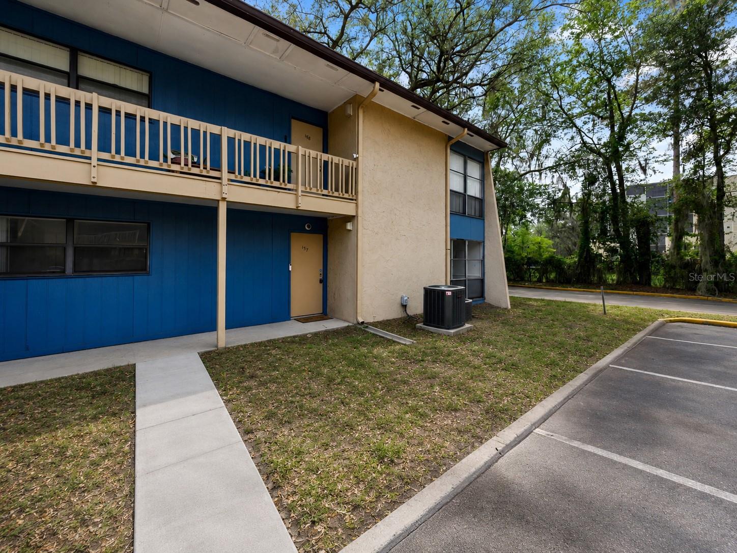 Virtually Staged. Updated 2-bedroom, 2-bath ground-floor condo in Brandywine Condominiums, offering 1,226 square feet of bright, functional living space just minutes from UF and UF Health. The interior features a spacious living and dining area with large windows, neutral finishes, glossy tile flooring, and great natural light. The kitchen has been nicely updated with gray cabinetry, stone-look counters, tile backsplash, stainless range, microwave, dishwasher, and a comfortable dining area nearby. Both bedrooms are generously sized with excellent closet space. The ensuite bath features an updated vanity and walk-in shower, while the second bath offers an updated vanity and tub/shower combination. Additional updates include HVAC installed in 2023 and water heater installed in 2024. Enjoy a covered back patio with exterior storage and a peaceful setting with mature trees throughout the community. Brandywine offers community amenities including a pool, clubhouse/game room, fitness room, and laundry facilities. The association also covers water, wastewater, exterior pest control, and exterior maintenance, adding convenience and value. Highly convenient Gainesville location close to campus, hospitals, shopping, dining, and major roads.