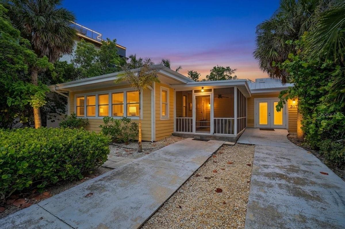 Welcome to your dream getaway, an adorable bungalow located on the north end of Anna Maria Island, directly across from the beach and a lovely park. This charming 3-bedroom, 3-bathroom home is perfect for a full-time residence, an income-generating rental, or a part-time retreat—all in an unbeatable location. Step inside to discover a welcoming living room with beautiful hardwood floors and delightful beach views, seamlessly connecting to the dining area for an open and inviting layout. The kitchen features wood cabinets, sleek quartz countertops, and stainless steel appliances, along with convenient countertop seating. The spacious primary bedroom includes a cozy sitting area and French doors that frame stunning beach views, complemented by an updated en-suite bathroom with a stylish glass shower. The second bedroom also boasts its own en-suite, providing comfort and privacy for guests. Outside, enjoy your private deck, ideal for sunbathing and grilling, complete with an outdoor shower for rinsing off after a day at the beach. The heated pool offers a refreshing retreat on warm days, while the covered, screened front porch is the perfect spot to relax with morning coffee and take in the serene blue waters. Located close to Pine Avenue’s boutique shops, delightful restaurants, and the picturesque Bean Point, this property features a durable metal roof, hardy board siding, and newer windows, enhancing its appeal and longevity. Don’t miss the chance to make this charming bungalow your own—schedule your showing today and embrace the island lifestyle!