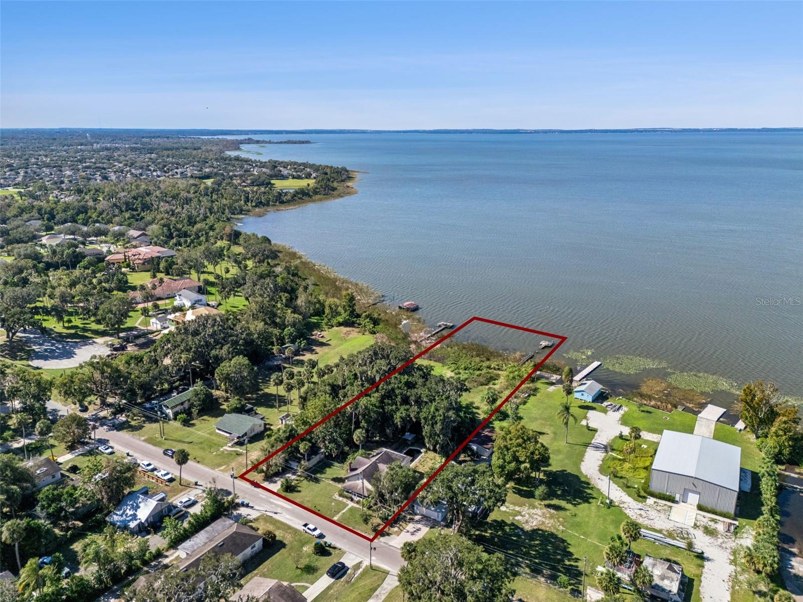 Lake Apopka Waterfront | C2 Commercial Zoning | Price Reduced
Rare lakefront commercial opportunity on Lake Apopka. This C2-zoned property offers flexible commercial potential along a growing waterfront corridor, with a recent price reduction reflecting property condition and redevelopment opportunity.
Located in an area experiencing significant investment and growth, with multi-million-dollar homes being constructed in nearby lakefront neighborhoods, this property presents a unique opportunity for investors, developers, or owner-operators looking to secure waterfront land with long-term upside.
Property Highlights: 
Direct lakefront property on Lake Apopka
C2 Commercial Zoning – multiple potential uses
Existing two-story structure with walk-out basement
Updated kitchen with large island and three ovens
Enclosed carport/garage
Private dock location (dock will require rebuilding)
Chicken coops and additional outdoor structures
Scenic water views and open outdoor space
Improvement Opportunity
The existing structure will require significant renovation and system updates, including HVAC, electrical, plumbing, and flat roof replacement. The shingle roof was replaced in 2016.
This offering is best suited for buyers prepared to renovate the existing structure, repurpose the building for commercial use, or redevelop the site to take advantage of the waterfront location.
Opportunity
With flexible C2 zoning, lakefront setting, and a newly reduced price, this property offers a rare chance to acquire waterfront commercial land with redevelopment potential in an area experiencing renewed investment and growth.