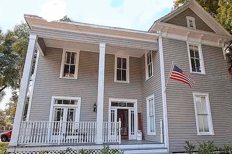 Step into the timeless charm of this 1900-built Bartow home offering over 2,800 square feet of living space. Filled with character and unique architectural details, this property blends historic appeal with everyday functionality.

Interior features include crown molding, French doors, and a wood-burning fireplace that adds warmth and personality to this beautiful home. The primary suite is located on the first floor and includes a sitting area.

Situated on a corner lot, the property also features a metal roof, fenced yard, balcony, a cozy covered front porch, workshop, and storage shed. With its distinctive character and spacious layout, this home presents a rare opportunity to own a piece of Bartow's history.