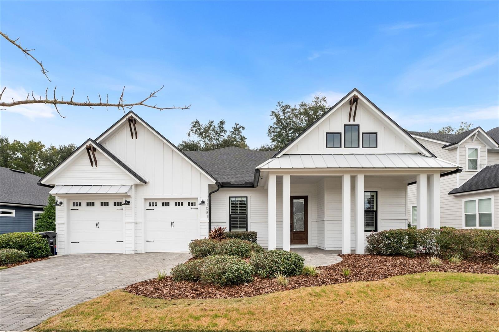 Perfectly positioned on a premium lot backing to a serene, treed conservation preserve, this exceptional ICI Homes Belaire floor plan with bonus room offers refined living in the highly sought-after Oakmont community. Featuring 4 bedrooms, 3.5 bathrooms, and a versatile bonus/flex space, this open, light-filled home is richly appointed with premium floor and wall tile, upgraded cabinetry and countertops, designer lighting, bronze windows, a trim-wrapped kitchen island, upgraded front door, epoxied garage, plantation shutters, and carpet only in bedrooms and stairs. Elegant plumbing finishes are highlighted by a spa-inspired free-standing tub. Additional highlights include an oversized stop-and-drop laundry room, a separate dining area, and a flexible space ideal for a home office, playroom, or gym. The gourmet kitchen is both spacious and inviting—perfect for entertaining—flowing effortlessly into the main living areas, where breathtaking views can be enjoyed from nearly every room. Outdoor living shines on the screened lanai, complete with an outdoor kitchen and fireplace, all overlooking tranquil preserve views that create a true private retreat. Oakmont offers unmatched resort-style living with Gainesville’s premier Residents Club, full-time Lifestyle Coordinator, fitness center, spectacular pool with splash pad, tennis and basketball courts, scenic trails, and more. With convenient access to shopping, dining, and major attractions, this home delivers an exceptional blend of luxury, serenity, and everyday convenience in one of Gainesville’s most desirable communities.