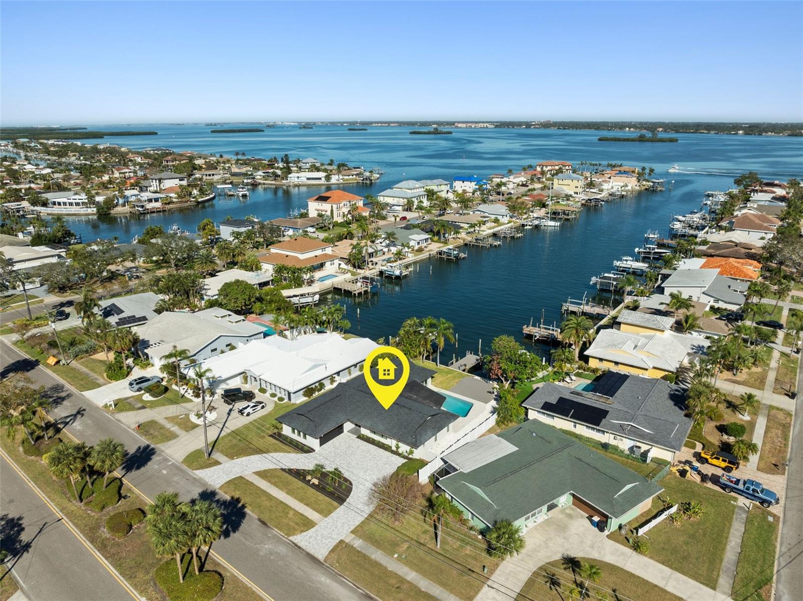 Auction Property. Auction Property. **AUCTION** List Price is the OPENING BID. Public Sale**Auction held LIVE ON SITE at the house SAT June 20th @ 12 Noon. Sold Free and Clear of ALL Liens. Pay Attention!! Waterfront Luxury Without Compromise in a home that was never flooded by the Hurricanes. Positioned on deep water in the heart of Island Estates, this fully reimagined 4-bedroom, 3 full , 2 half-bathroom residence delivers the kind of waterfront life most people only dream about and it does it without a single item left on your to-do list. Set on sailboat water with direct, bridge-free access to the open Gulf, larger vessels dock with ease at the private 30x6 ft dock, and open water is minutes away. This is not a boating community nod, this is a true boater's address. Inside, a top-to-bottom Scandinavian-inspired renovation creates a home that feels as calm and intentional as its setting. Wide plank engineered hardwood floors anchor the open concept layout, where every room flows with purpose. The chef's kitchen features a large island, quartz countertops, a walk-in pantry, and a dedicated breakfast counter that makes the kitchen feel like a destination of its own. Two primary suites each with private en-suite baths and walk-in closets offer flexibility for multi-generational living, frequent guests, or simply having your own world within the home. Step outside and the pool, deck, and canal align in one uninterrupted sightline. The outdoor half bath keeps the entertaining seamless, and the west-facing exposure means evenings here are something special. Every major system has been replaced: New roof New HVAC and ductwork Hurricane impact windows and doors throughout New bathrooms and water heater Paver driveway Per the seller, this home has remained high and dry through every recent storm — a rare and meaningful distinction at this price point. A quick golf cart ride puts you at Publix, local restaurants, and everyday conveniences, with Clearwater Beach just minutes beyond. Island Estates is one of the most sought-after waterfront communities on Florida's Gulf Coast, and this address sits right at the center of it. Move-in ready. Nothing left to do but live here.