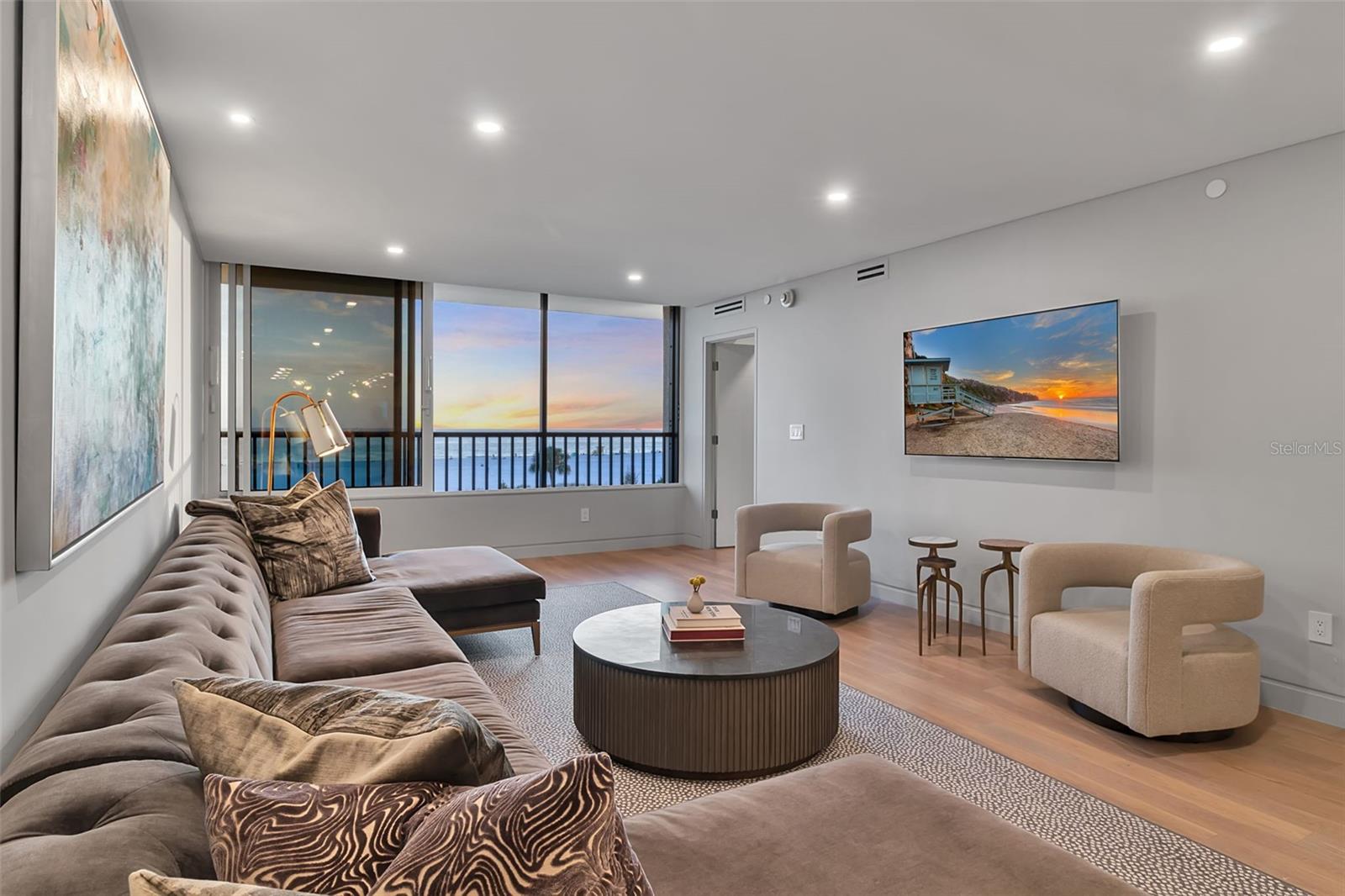 A rare and exceptional offering within Building F at Gulf & Bay Club on Siesta Key, Unit 403 presents a truly one-of-a-kind coastal retreat. Completely taken down to the studs and reimagined in 2023, this residence showcases a meticulous, high-end renovation where no detail was overlooked.

From the moment you enter, you’re welcomed by a light-filled, open-concept design with sweeping direct Gulf views that immediately set the tone. The chef’s kitchen is the centerpiece of the home, anchored by a stunning 12-foot oversized island with seating for six. Featuring eco-friendly PaperStone countertops and backsplash, a full suite of premium Thermador appliances, and seamless custom finishes, the space is as functional as it is striking—all complemented by breathtaking water views as you cook and entertain.

Offered turnkey furnished, the interiors are thoughtfully curated with pieces from Arhaus, Restoration Hardware, and other luxury brands, creating a cohesive and sophisticated aesthetic. The open layout flows effortlessly from kitchen to dining to living, enhanced by custom built-ins that provide both style and smart storage, including a paneled wine refrigerator.

Wake up to the Gulf from your private primary suite, a serene retreat designed for both comfort and elegance. This space features a dedicated vanity area, custom walk-in closet, and a beautifully appointed en-suite bath, offering a spa-like experience within your own home.

Additional highlights include engineered hardwood flooring throughout, hurricane-impact windows and sliders, solid-core doors, and extensive custom storage solutions—all contributing to the home’s elevated design and livability.

This two-bedroom, two-bath residence is set within the highly sought-after Gulf & Bay Club, where residents enjoy an unmatched, resort-style lifestyle across 32 acres of lush, manicured grounds. Indulge in 800 feet of private, powdery white sand beach, three heated pools, tennis and pickleball courts, a state-of-the-art fitness center with yoga studio and saunas, and multiple clubhouses featuring lounges, billiards, and social spaces. Additional amenities include barbecue and picnic areas, freshwater lakes, and EV charging stations.

Ideally located just moments from the dining, shopping, and vibrant energy of Siesta Key Village—including the iconic Sunday Drum Circle—this residence offers the perfect blend of privacy, luxury, and convenience.

Unit 403 is more than a home—it’s a rare opportunity to experience the very best of Gulf-front living on Siesta Key.