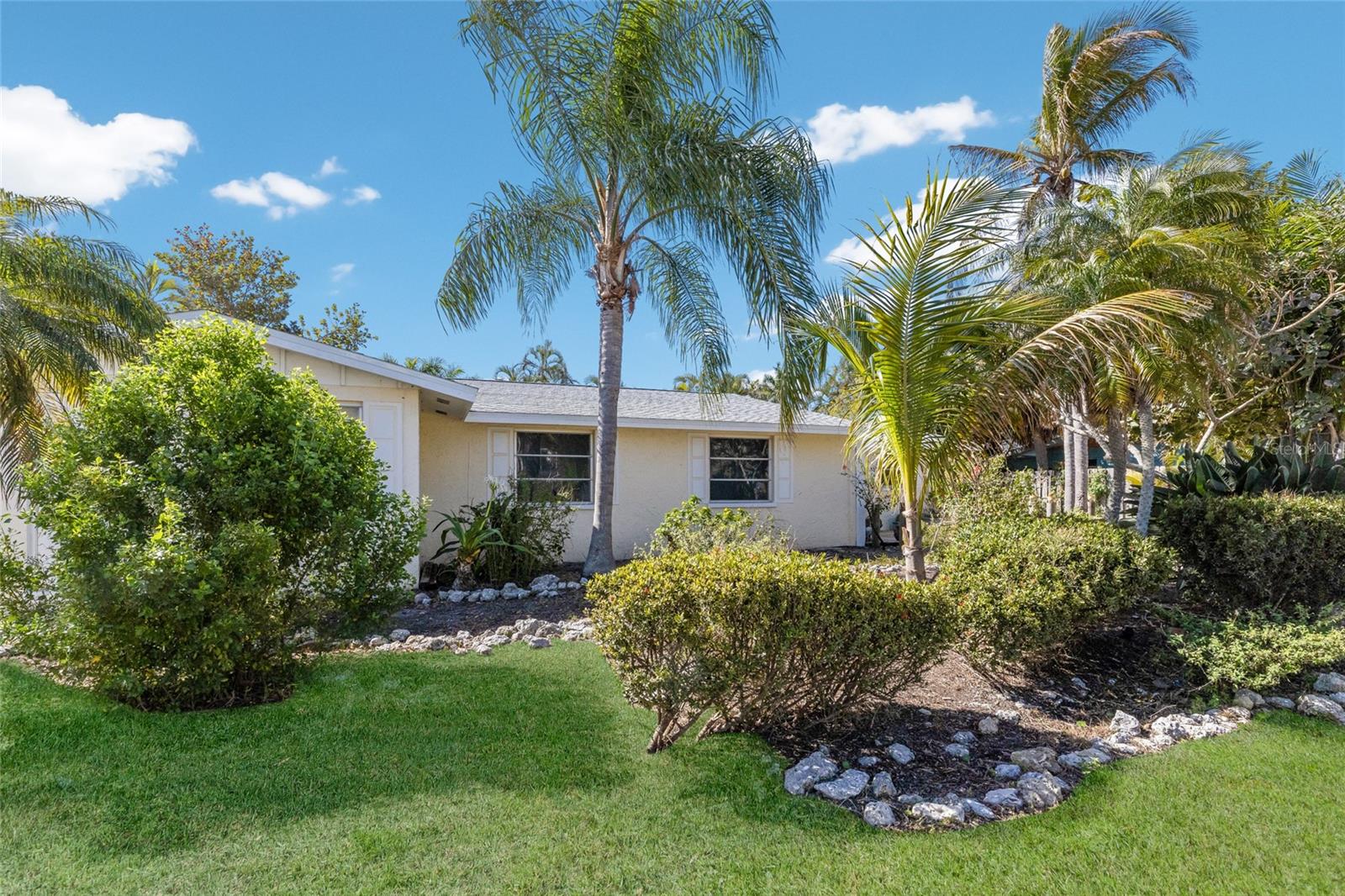 Discover this 4 bedroom, 3 bathroom versatile home, perfectly positioned on Anna Maria Island for effortless coastal living. Located on a spacious 0.23-acre lot (approximately 9,988 sq ft), this property offers many possibilities!!  If desired, this home can easily be changed back to a duplex with some modifications making it a 3 bedroom, 2 bathroom unit on one side and a cozy mother in law suite that is 1 bedroom, 1 bathroom unit on the other.  Whether you're seeking a multi-generational home, a vacation retreat with rental potential, or an income-generating investment, this setup provides flexibility and charm in one of Florida's most desirable beach communities.
Ideal for families or entertaining, featuring ample room for comfortable island-style living.  Step outside to a backyard with plenty of space to add your dream pool, creating a private oasis for relaxation under the Florida sun.  Or keep the awesome Koi pond and zen feels of the backyard.  With its prime location, you're just a short stroll from pristine white-sand beaches and gorgeous sunsets.  Walking distance to Holmes Beach restaurants and shops.  Schedule a showing today!